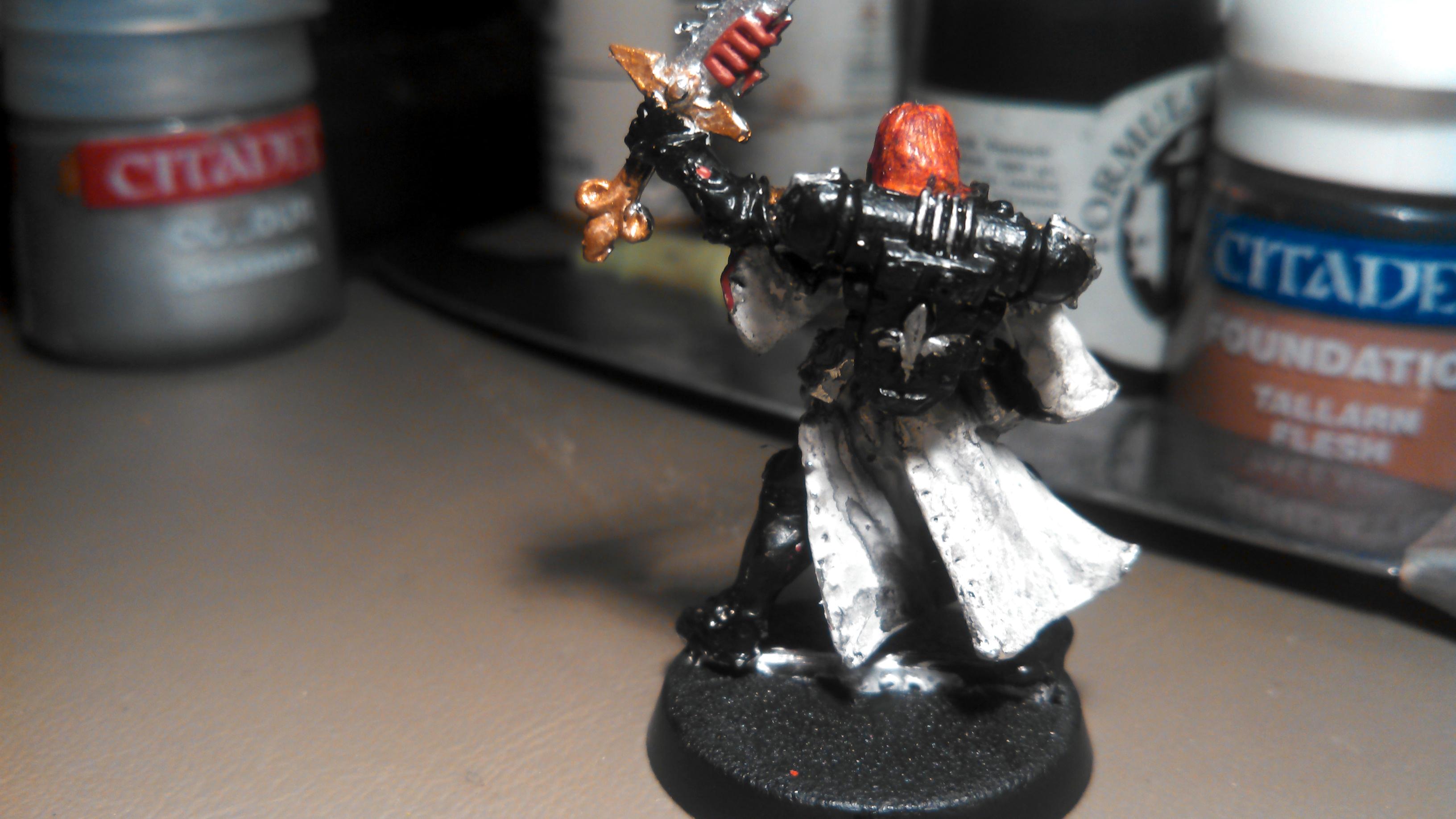 back view of Sister Superior with chainsword