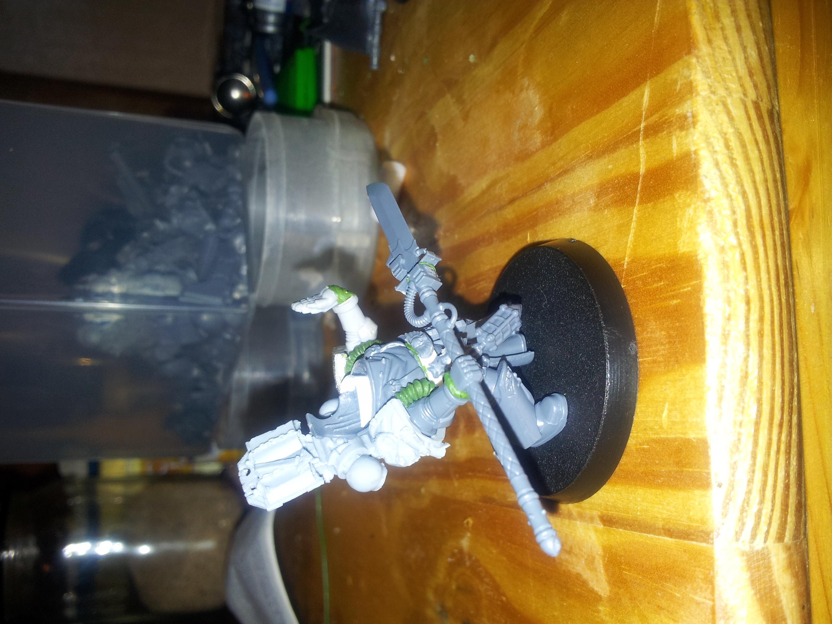 im abit stuck as to what to do about adding a cloak/cape. my green stuff technique isnt to strong yet but im try a couple of ideas. update to follow