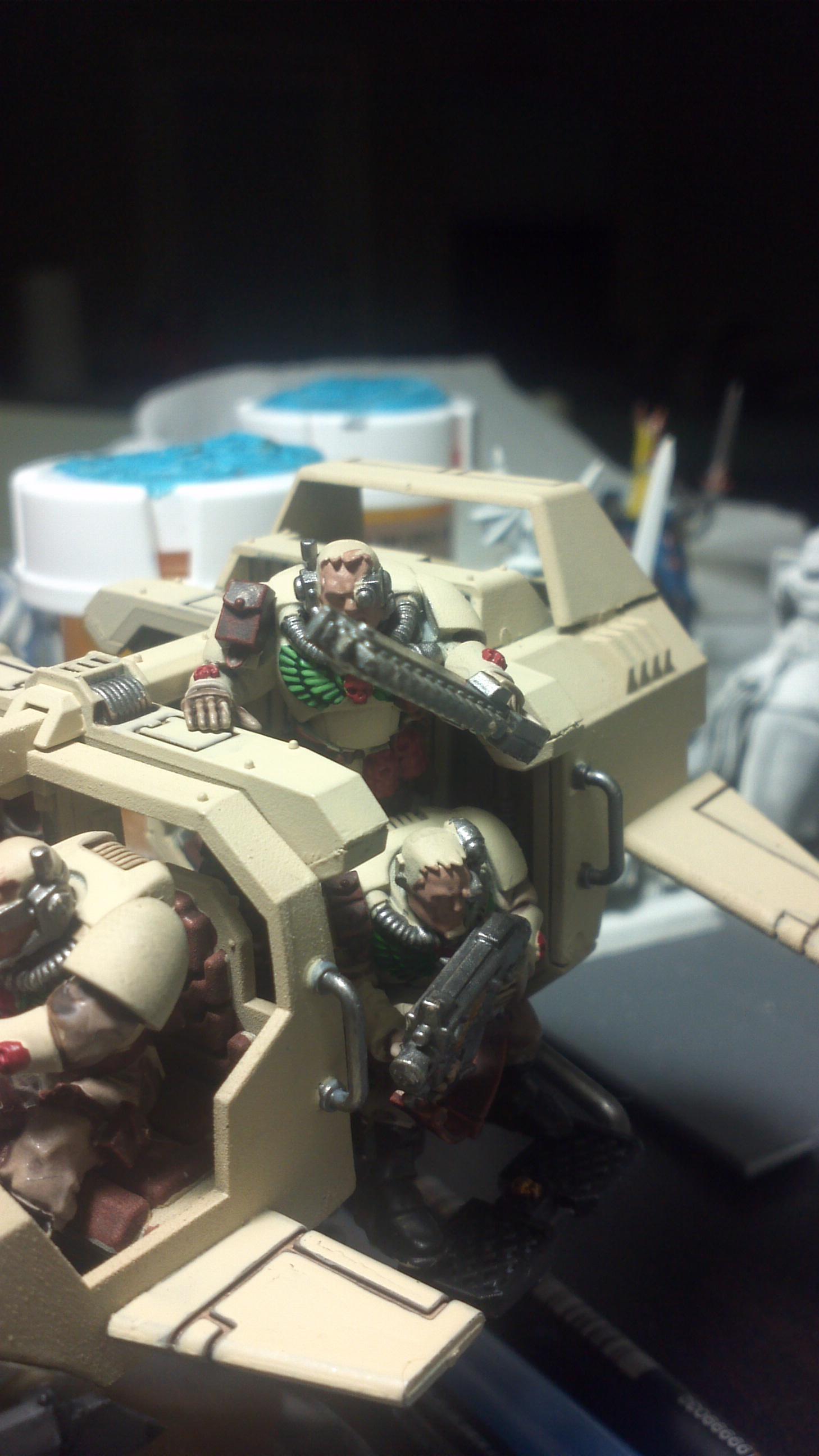 The sergent is eagerly looking for the target while the other dude looks like he had a big lunch
