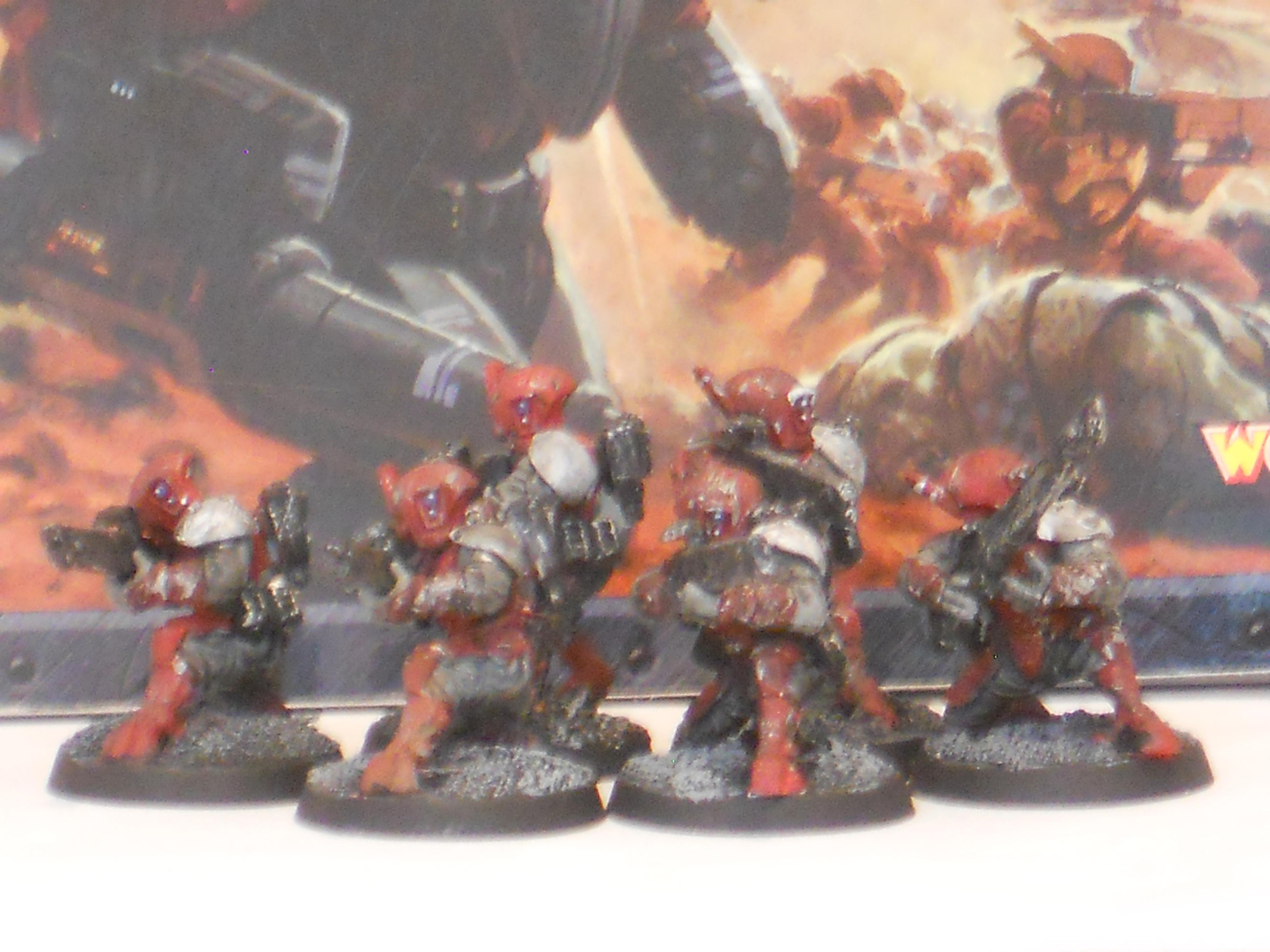 The 6 fire warriors, with the converted (i guess) shoulder pads