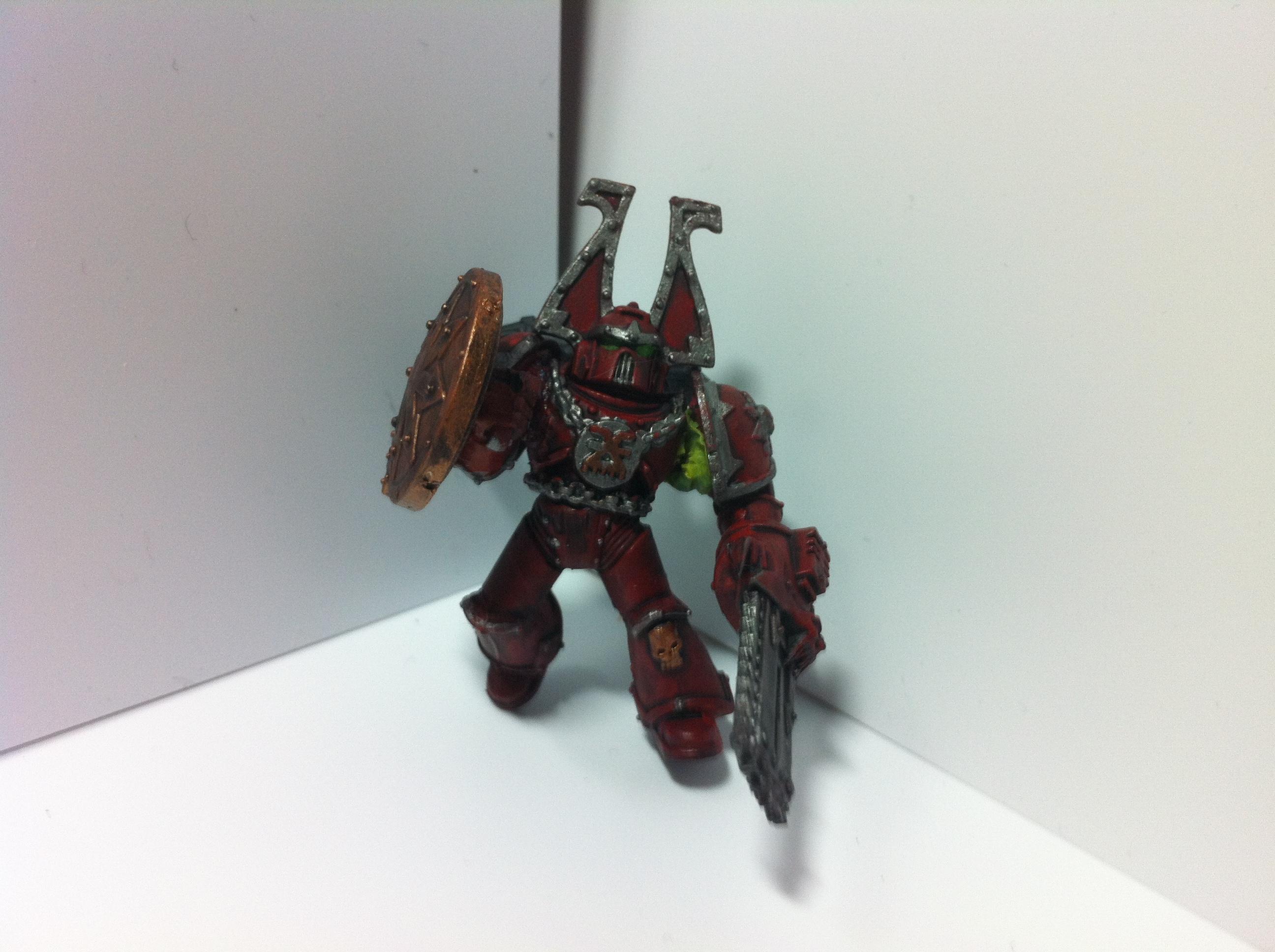 Work in progress, Khorne zerker w/ shield/Chainfist. Greenstuff is drying for arm pose