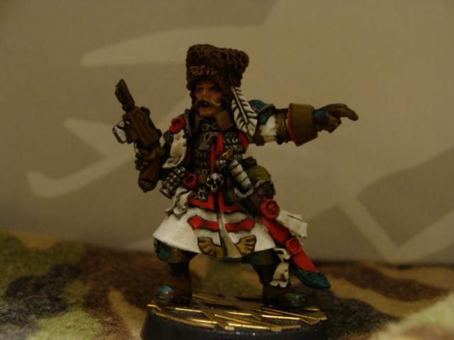 I think he looks far too father christmas. I think I'll paint the trim of his coat the yellow like the rest. Original plan was red for Sarge, Silver for Lieutenant, Gold for Col. 