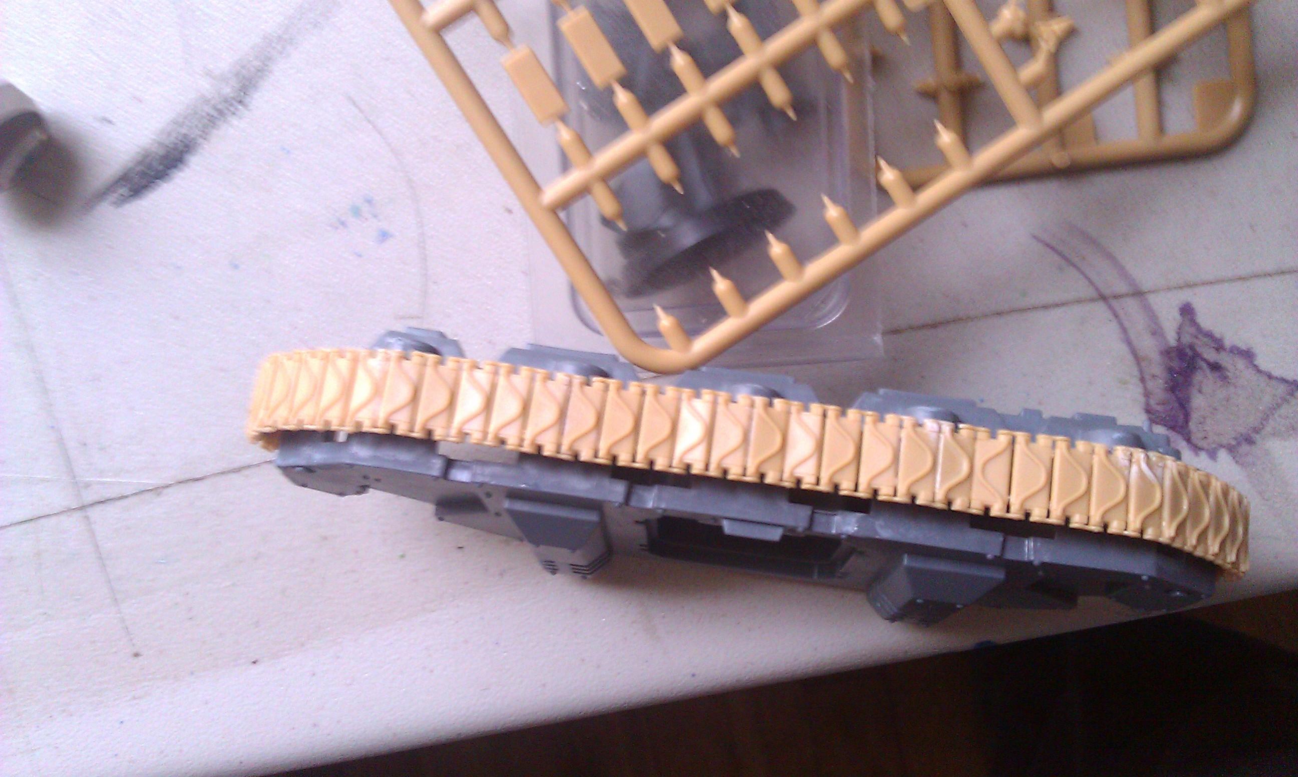 the tracks fit nicely around thed road wheels and give it more depth