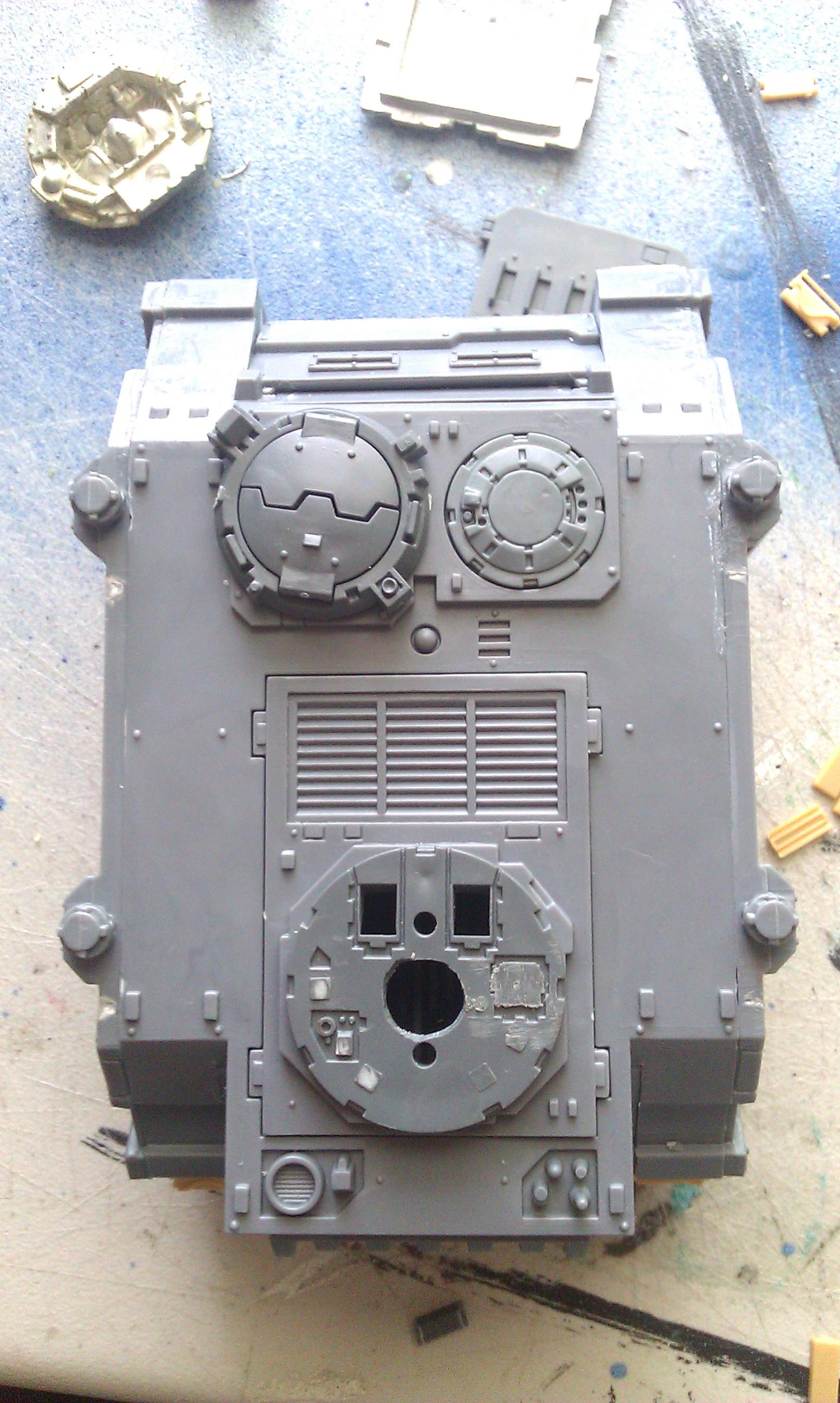 fitting the cover over and having the turret fitting in place