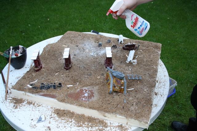 after sand was spricled all over the board, we spreyed watered down pvu all over it to hold the sand in place