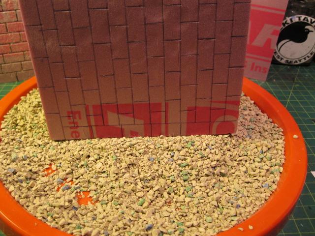 Now you need to add texture to the stone work . I am using kitty litter 