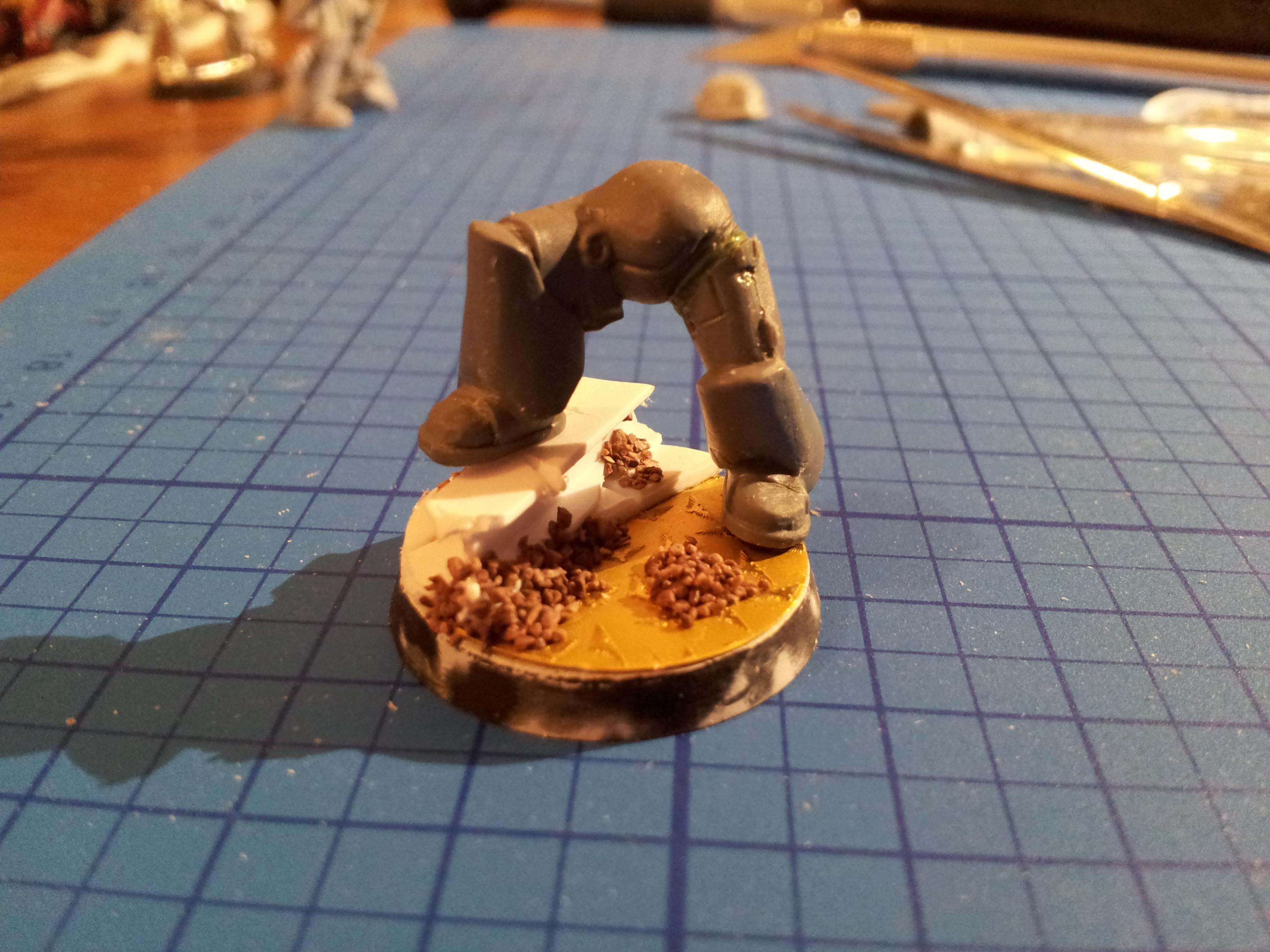 Base and posed legs. i hope this will make one of my sergeants stand out a it more. used the kneeling legs groin and right leg, and i used a left leg from the MK6 tactial marine sprue. filled the gap with a bit of greenstuff