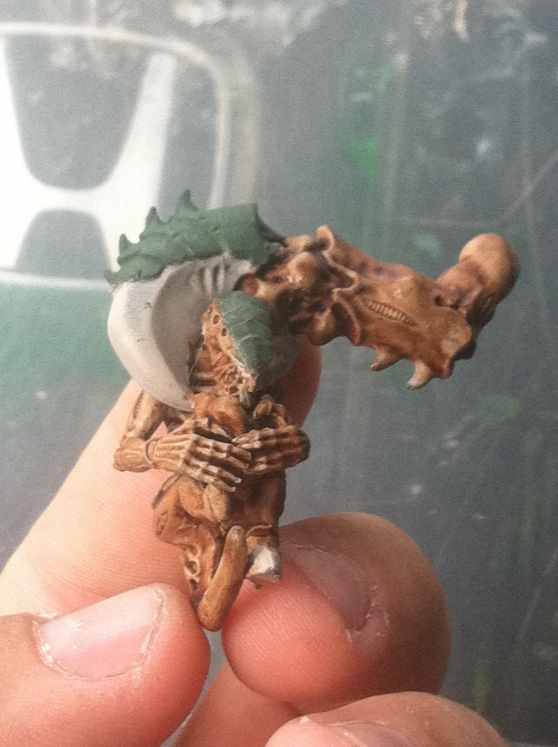 Termagant carried by the scruff