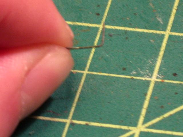 I take a length of thin wire and bend a small end to 90 degrees