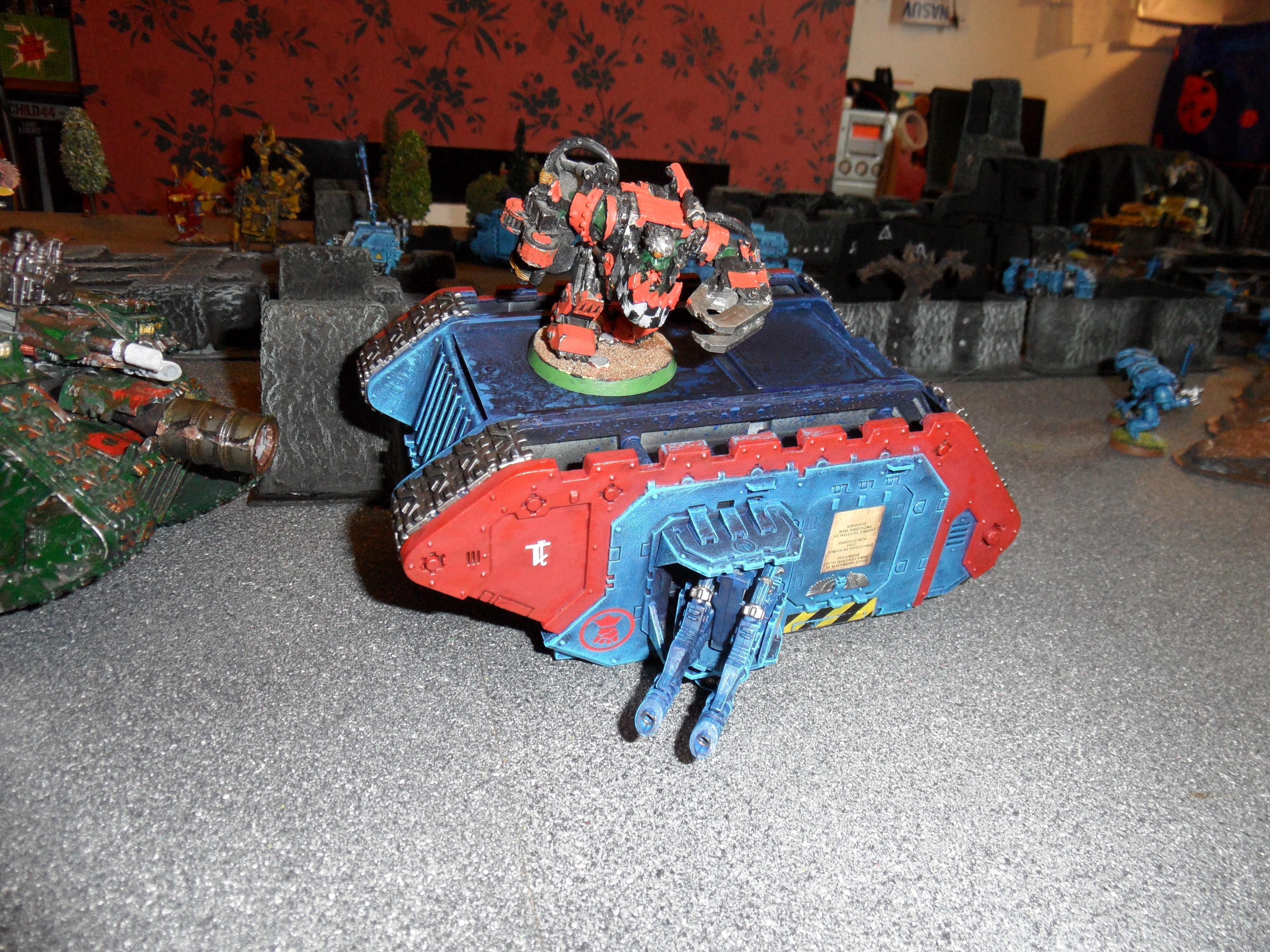 War Boss does a victory dance on the destroyed Land Raider