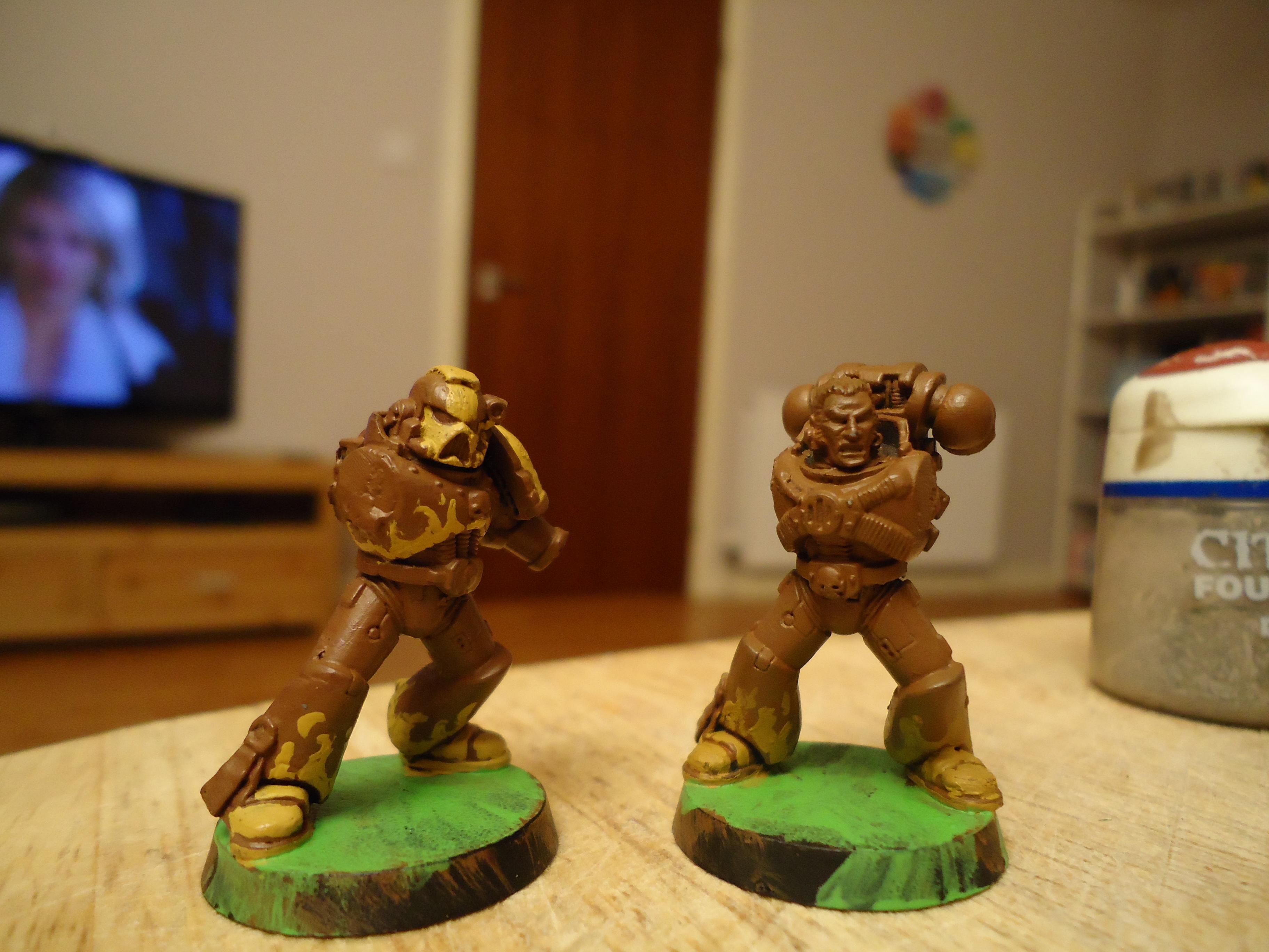 Left Marine is done in Iyanden Darksun, the right in Tausept Ochre