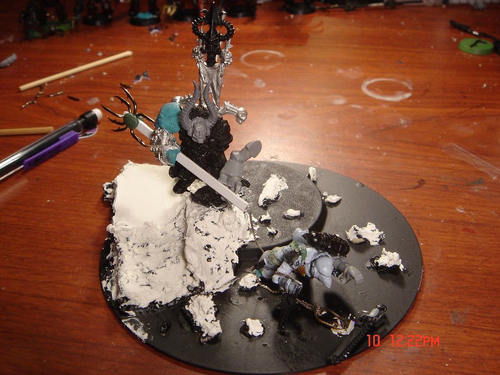 Chaos Lord spearing a space marine 