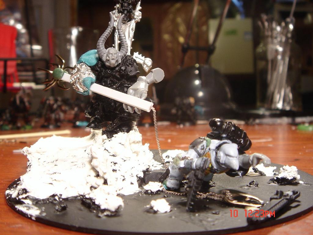 Chaos Lord spearing a space marine 