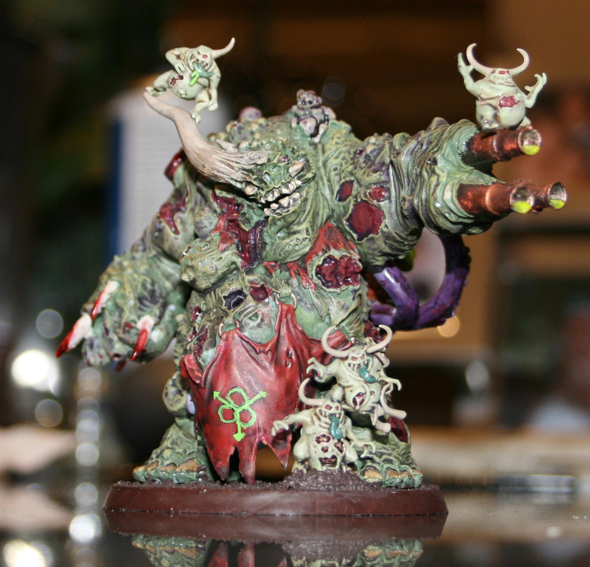 Dark colour scheme on the Daemon Prince and the light colour scheme on his nurglings
