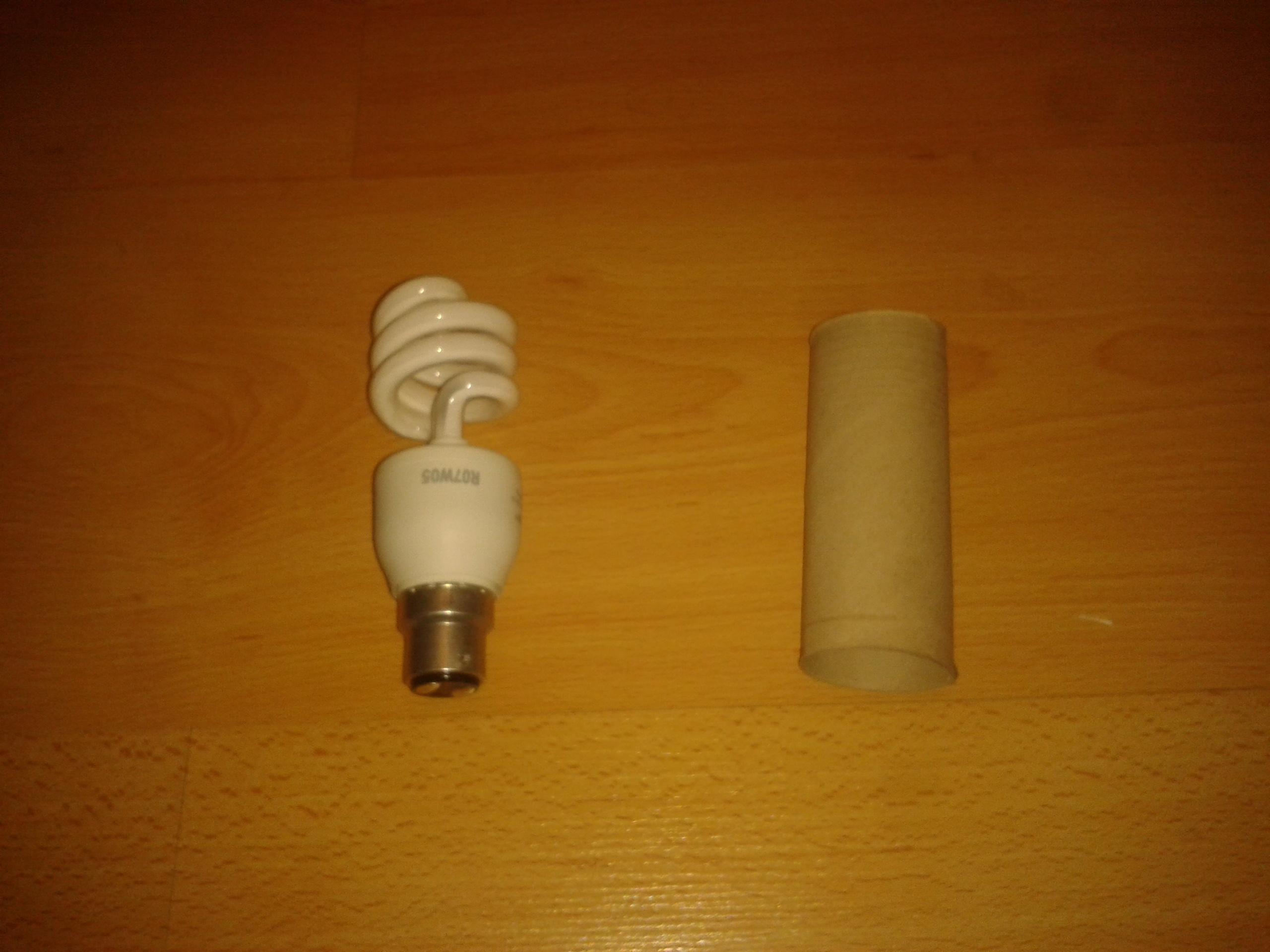 first i took the bulb & a cardboard tube. you can use any cylinder