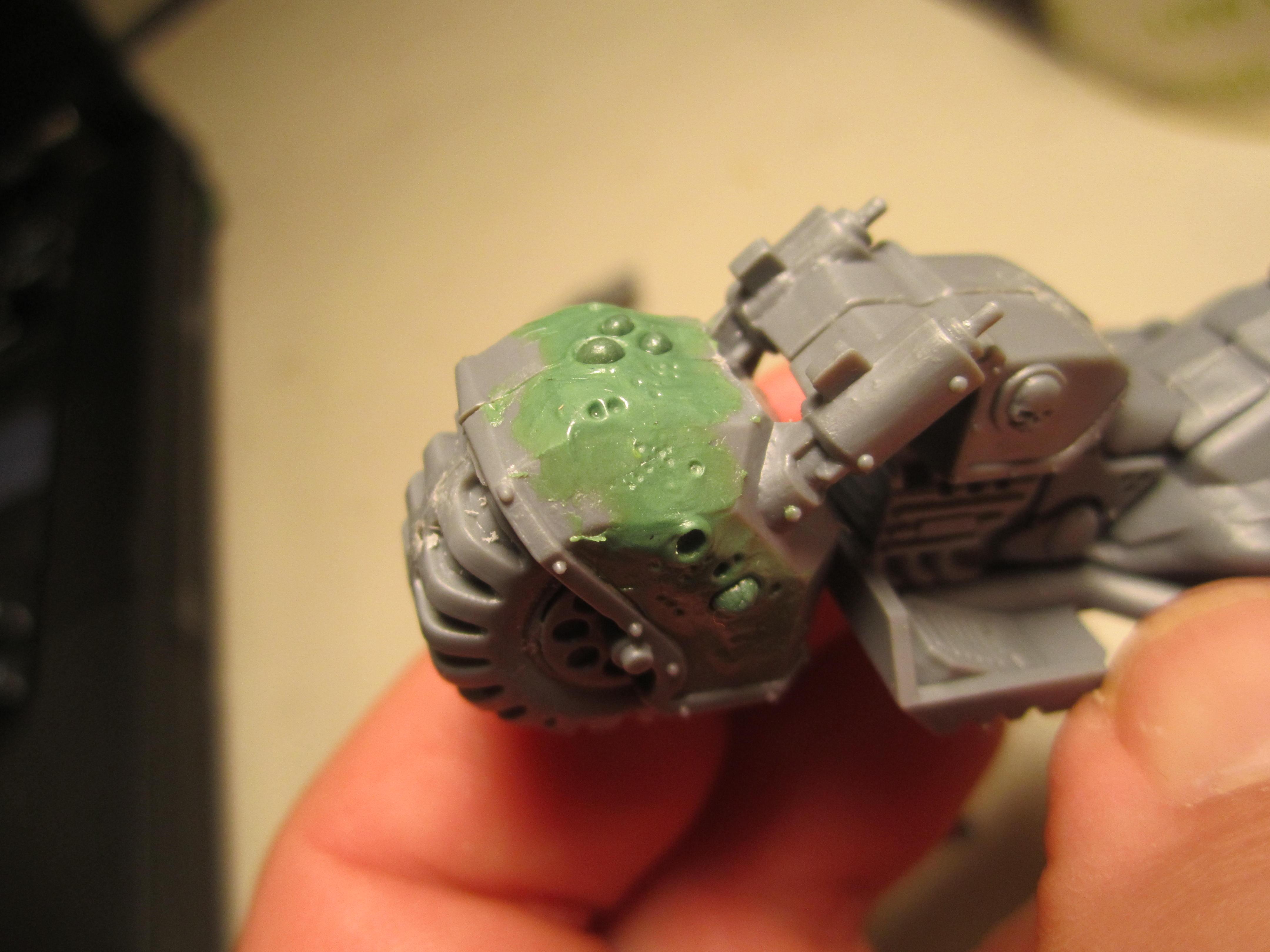 Texture by pressing small hardened balls of GS into the soft putty, and texture with a automatic pencil lead. 