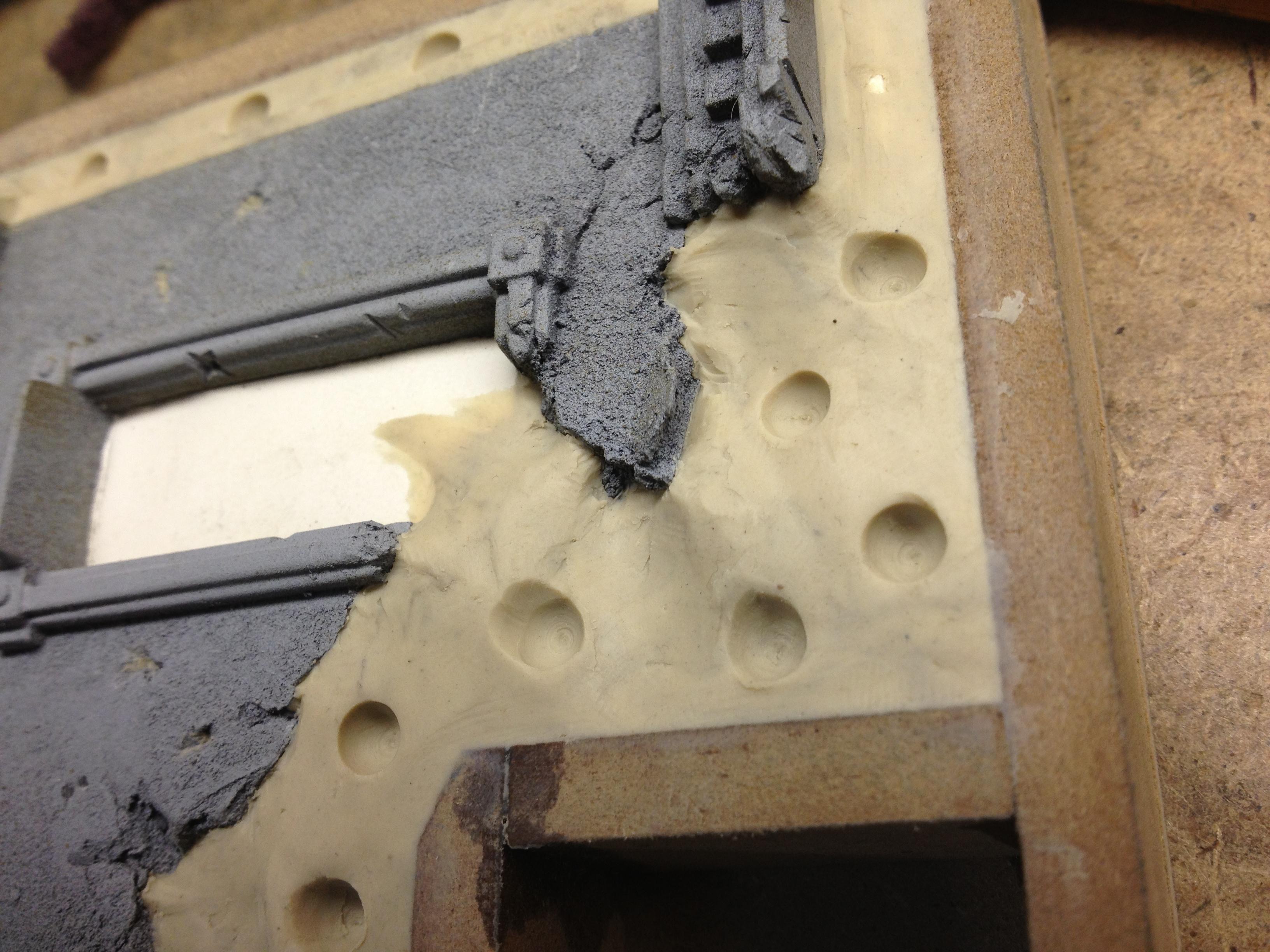 Detail of the clay up around the destroyed pieces..