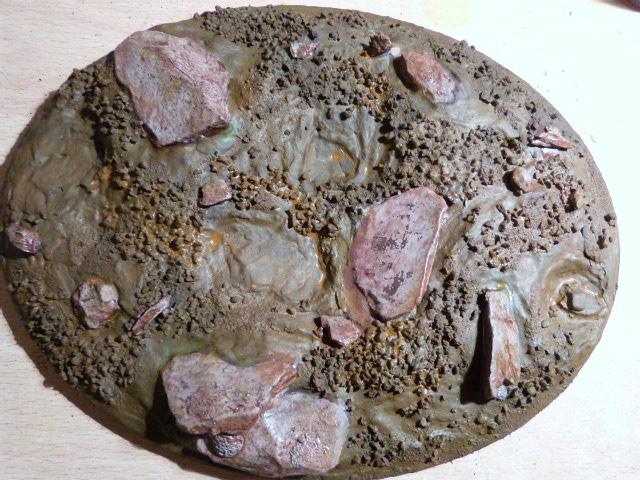 Given the rocks a cover in reddy brown wash to tie the whole effect together