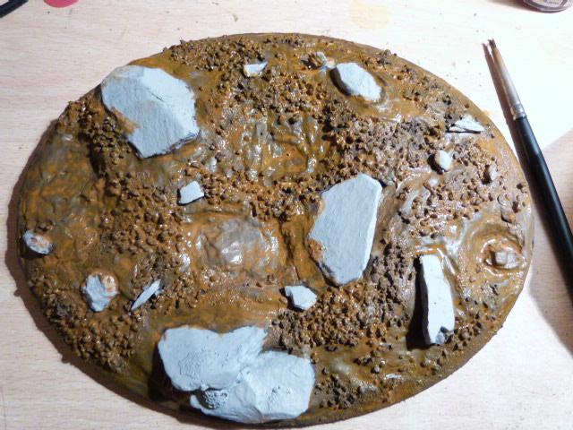 Added a light brown wash to the floor of the base, but not the rocks