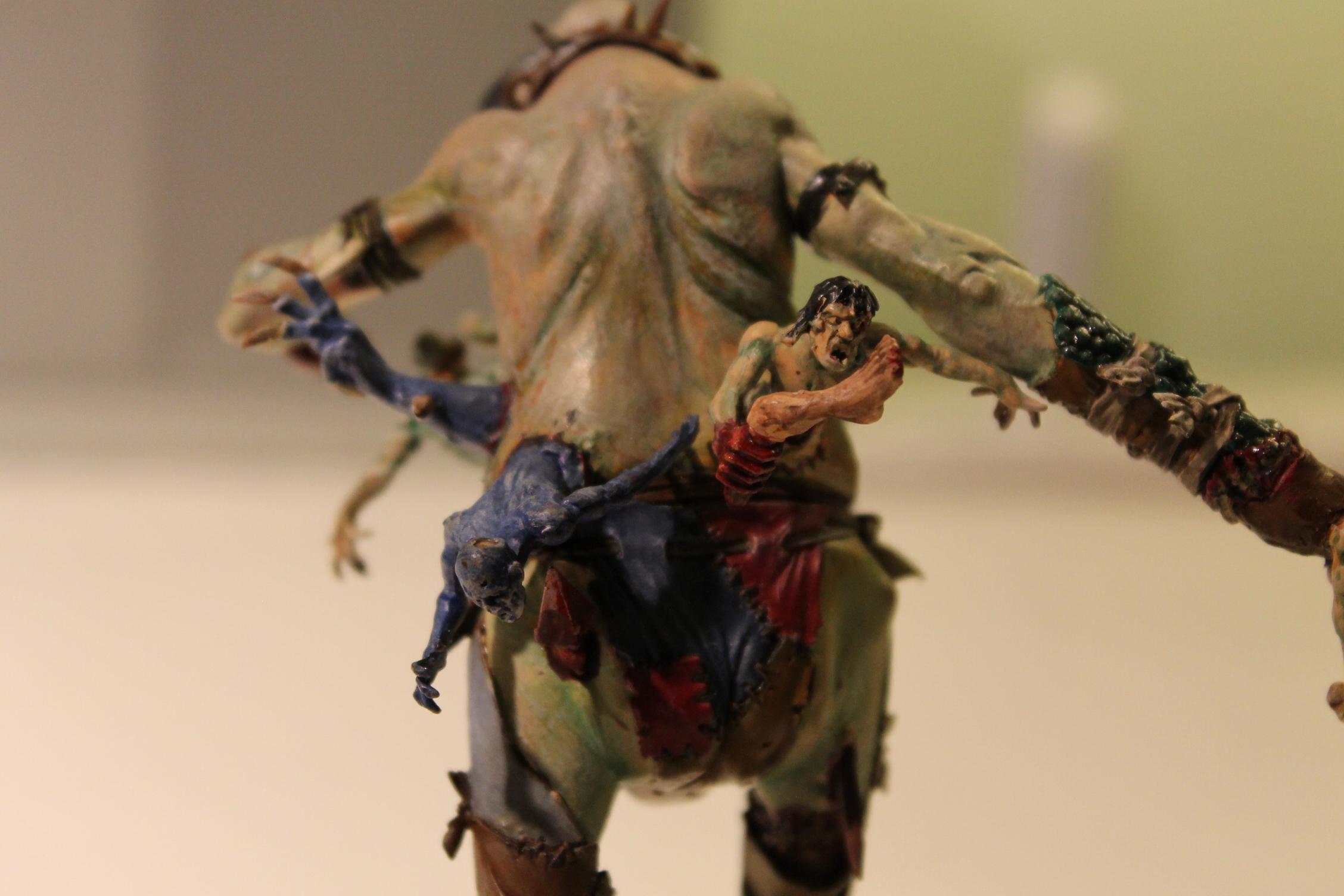 Zombie torsos have been stitched to it's belly to grab and tear at anyone who gets too close