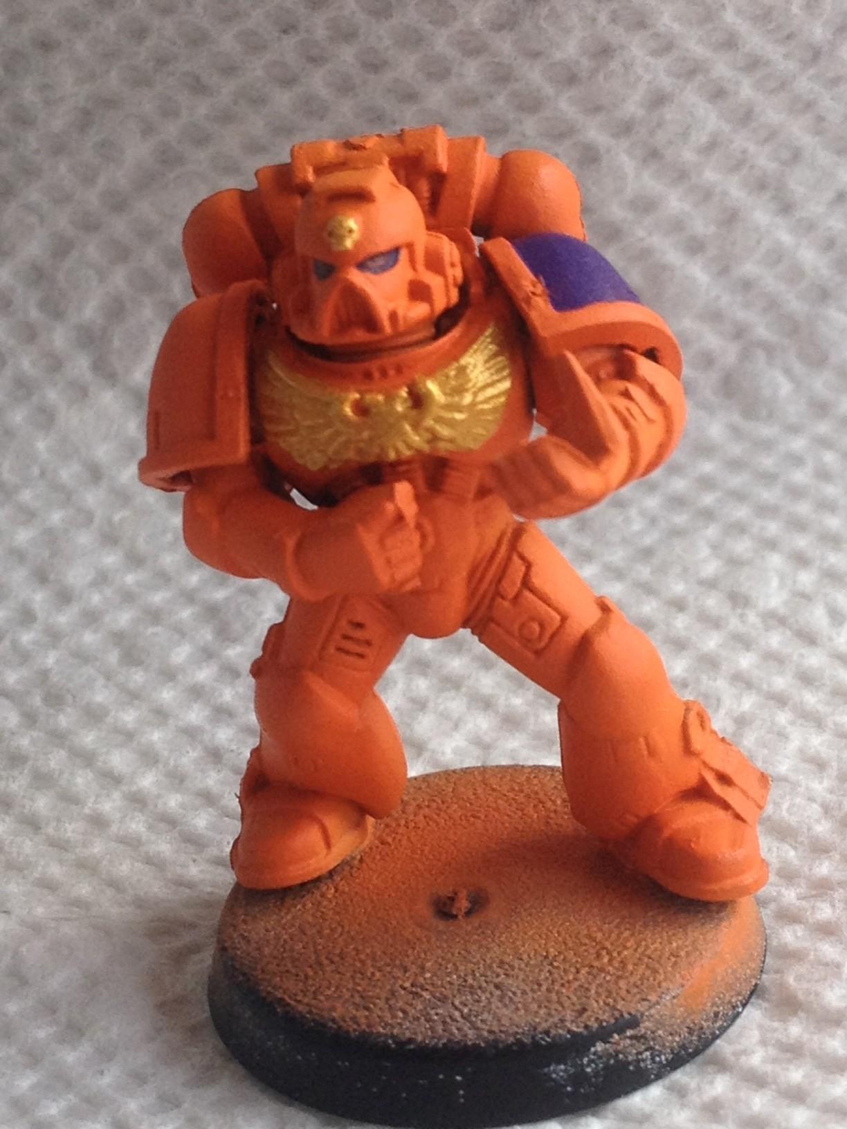 Did a light layer of Vallejo Model Color Lemon yellow and the GW Auric Armor Gold.  I need to learn to watter my metallics down a bit better
