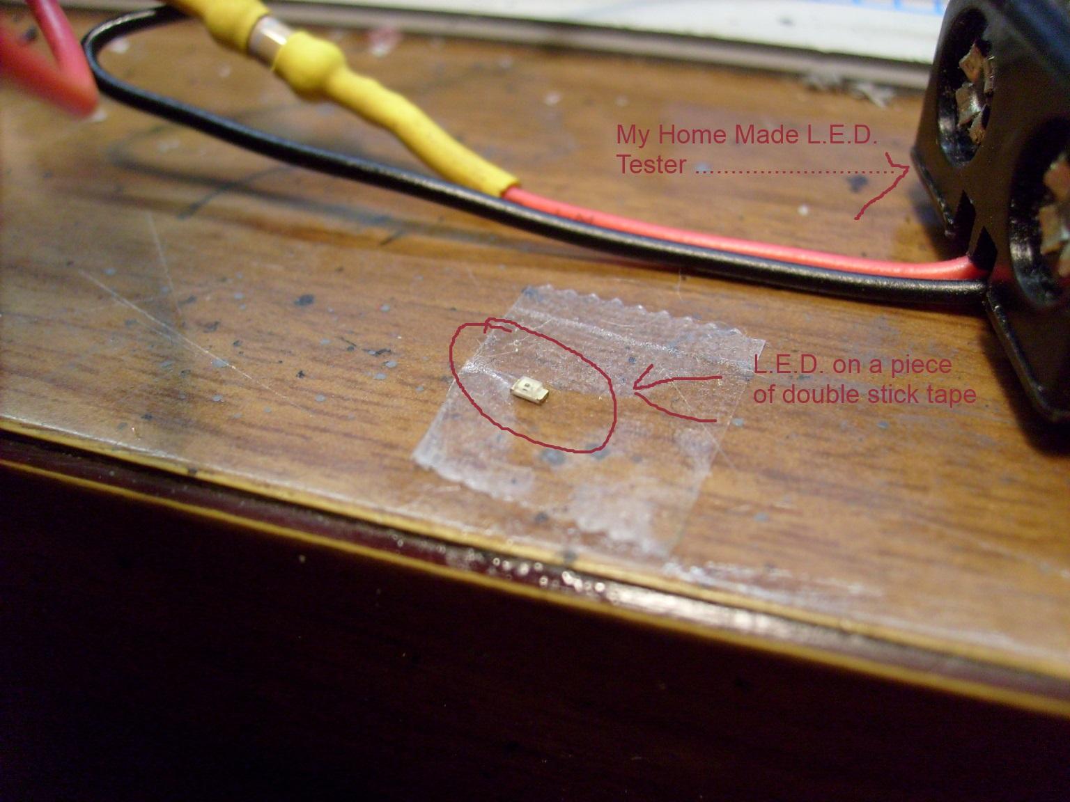 This is a tiny green LED on a piece of double stick tape .... Your breath can blow on of these into the Carpet Monster