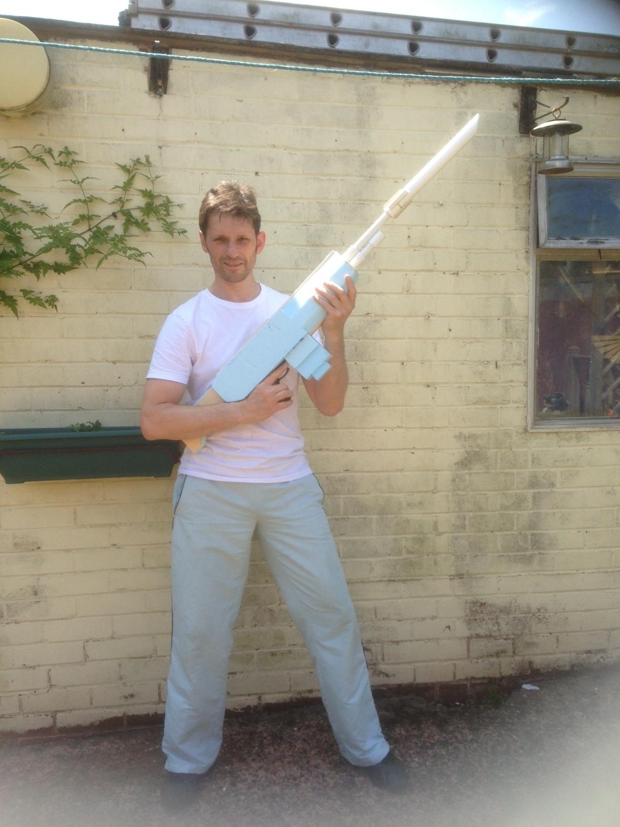 An adult with the rifle