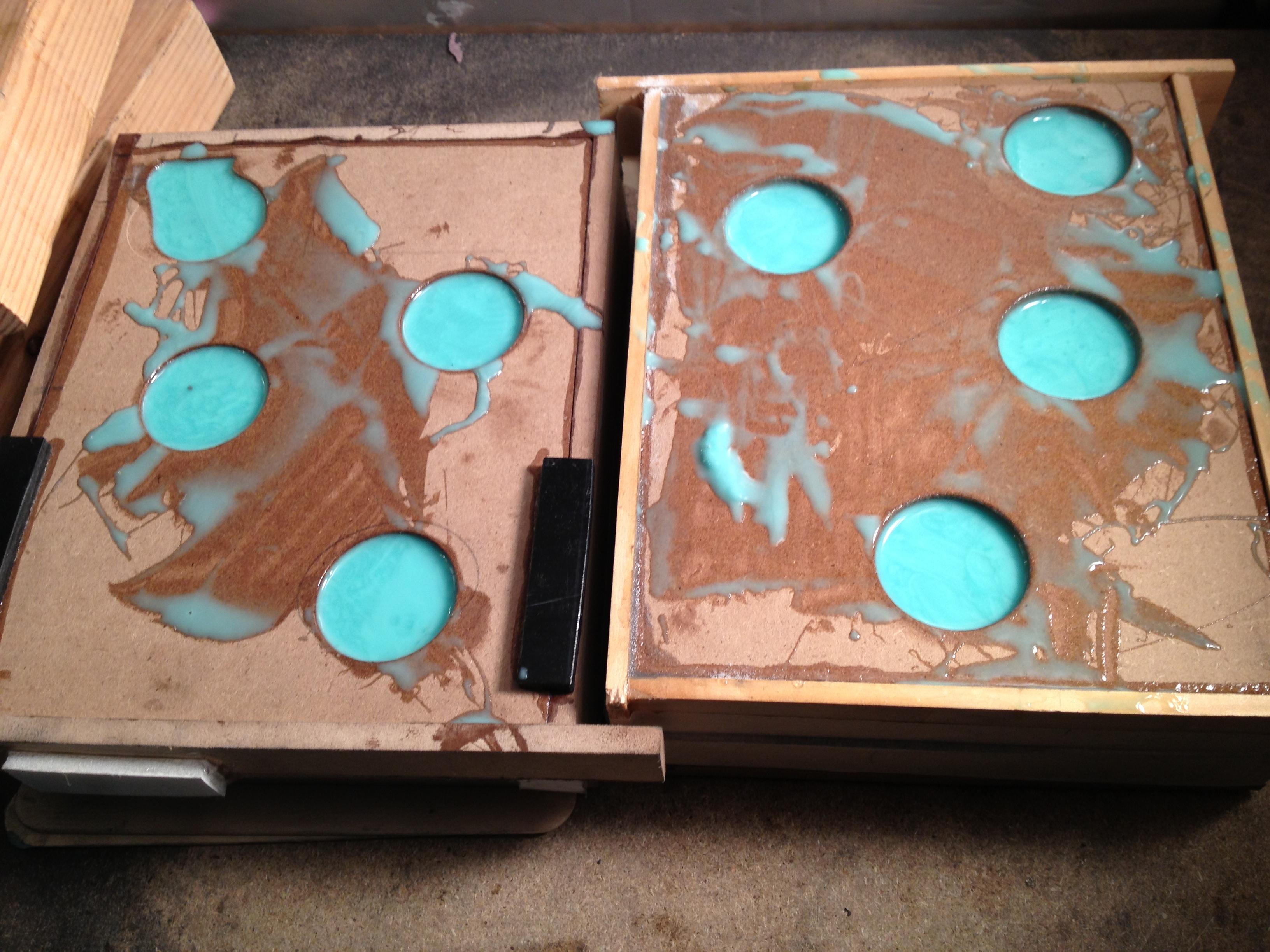 Molds are filled and placed into the curing "Oven"