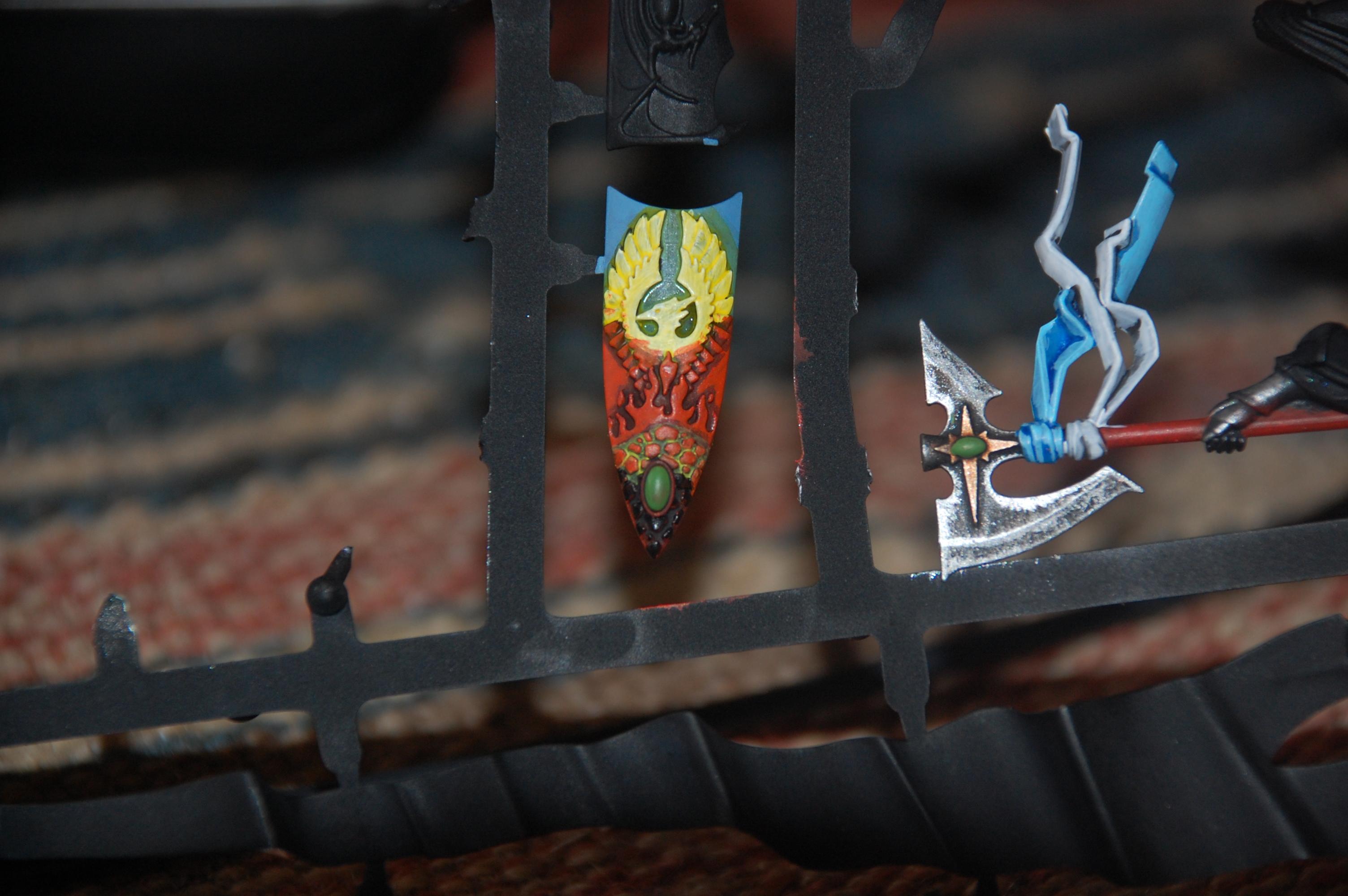 some more work on the shield i want it to look like the phoenix on it is arrising from ashes hope i get it to look like the picture in my head ^^