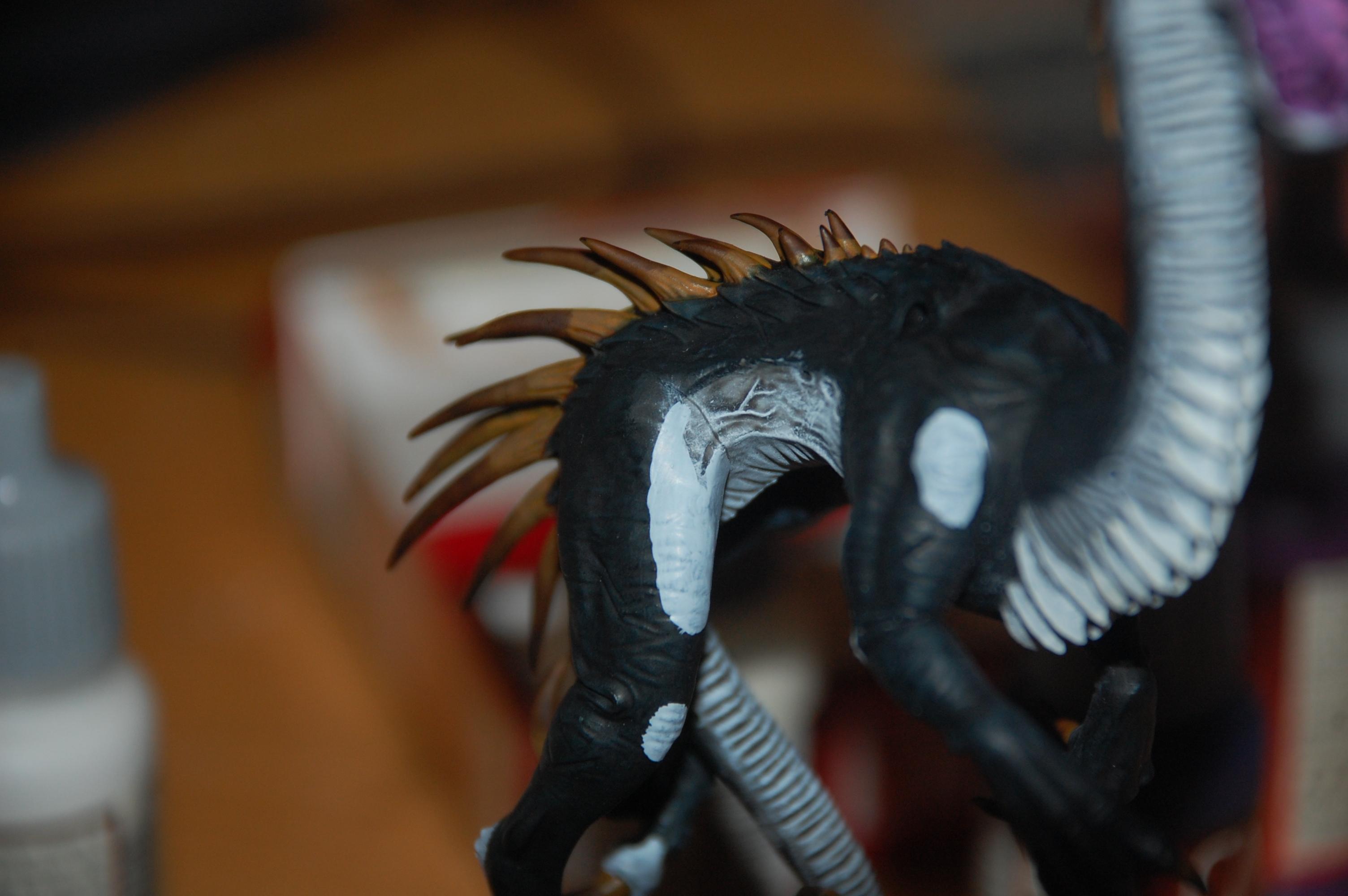 I found that there was a bit to much black on the dragon so to create a little bit more variation in color i added some more grey to different parts next batch of pictures will show the progress :)