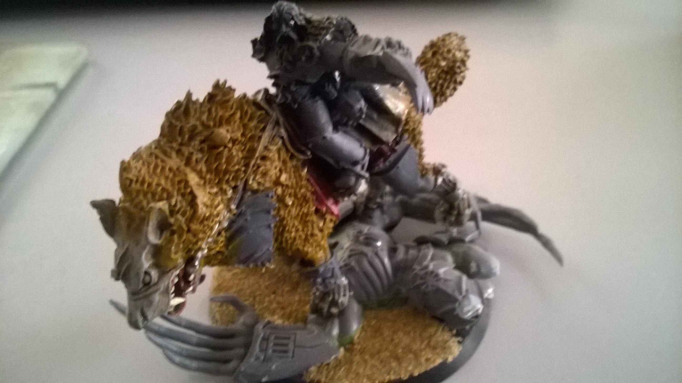 This is Johran Redbeard, Wolf Lord of the Wild Hunt. He's a metal Canis with Chaos termie lord claws, standing atop his latest kill, a daemon prince