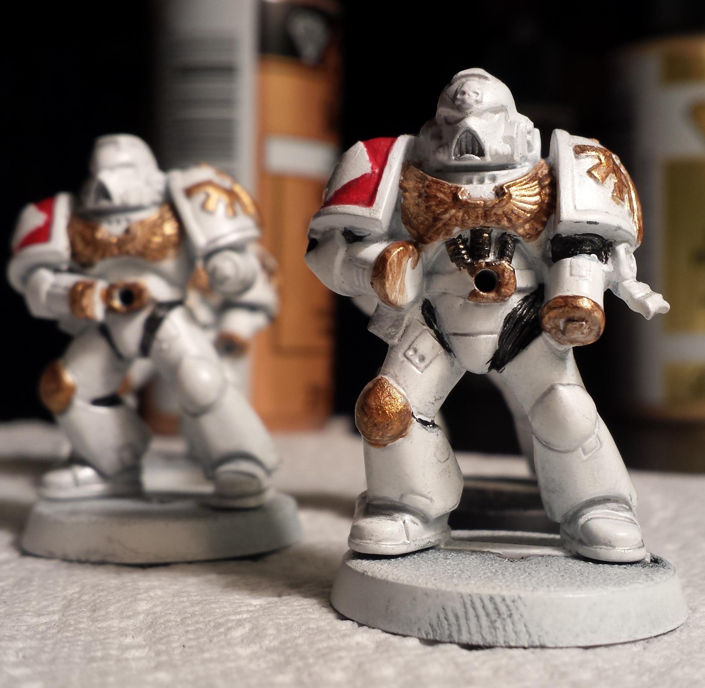 First coat of dark gold on the wrists, knee, and shoulder device