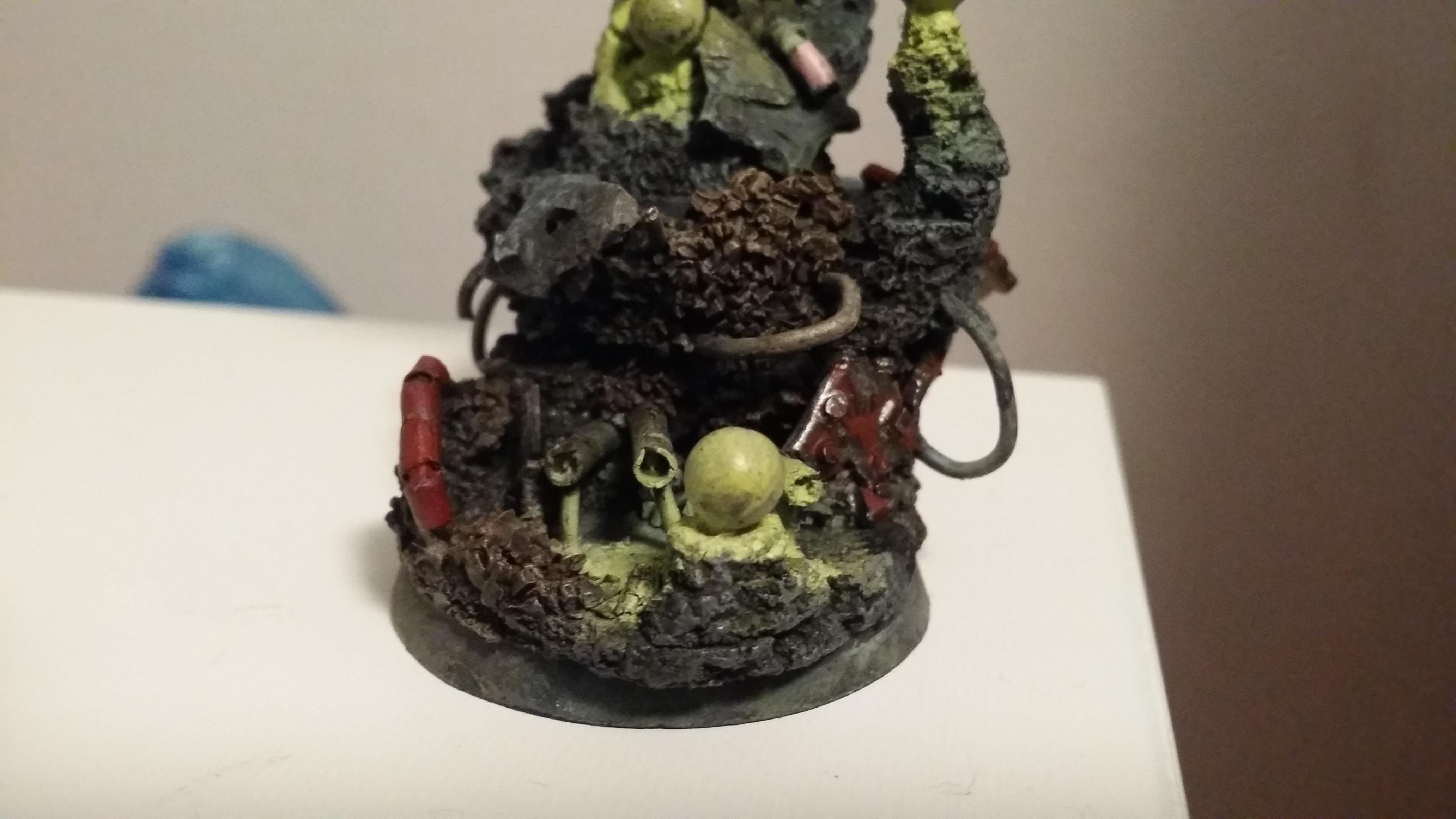 The base with the scattered armor plates and tank hatch started to be painted