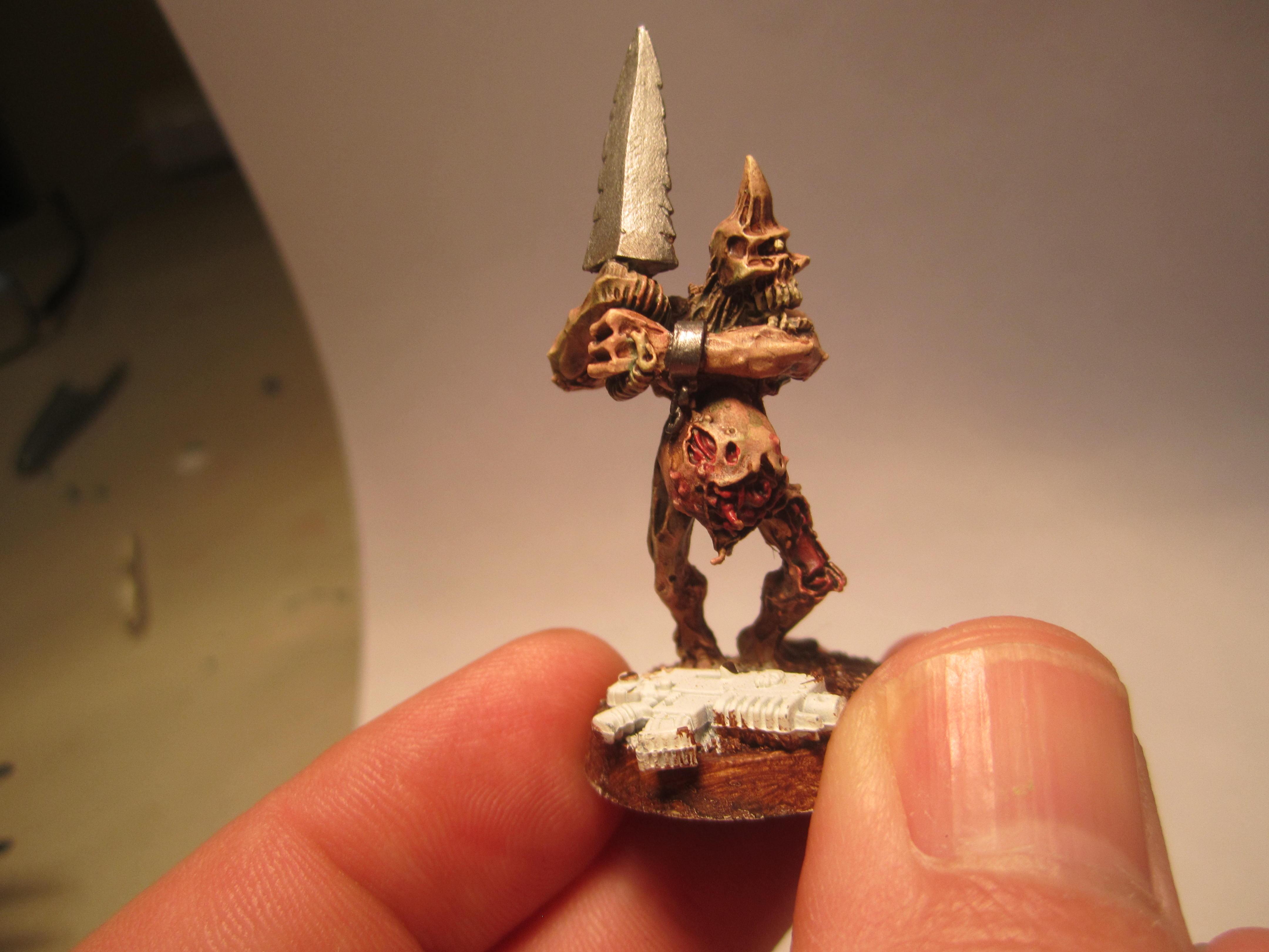 second model with the same sculpt.  THe base are different and this one is slightly lighter in color
