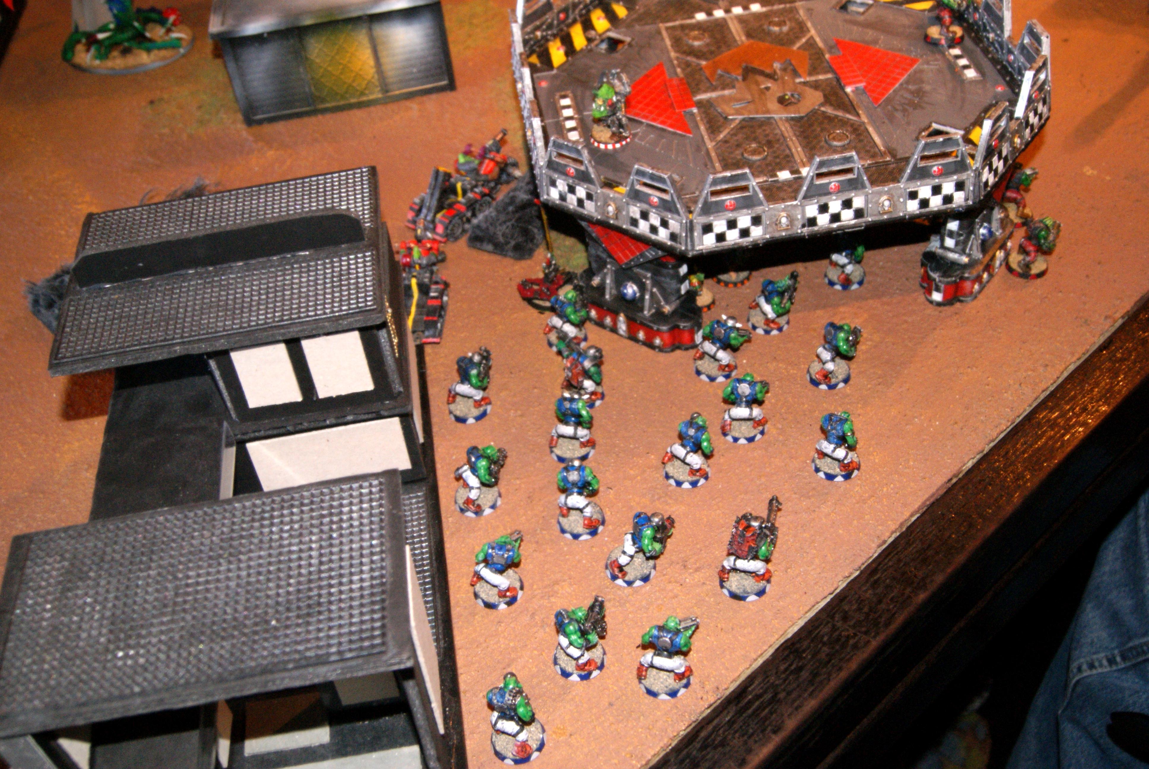 Orks swarm from the ruins