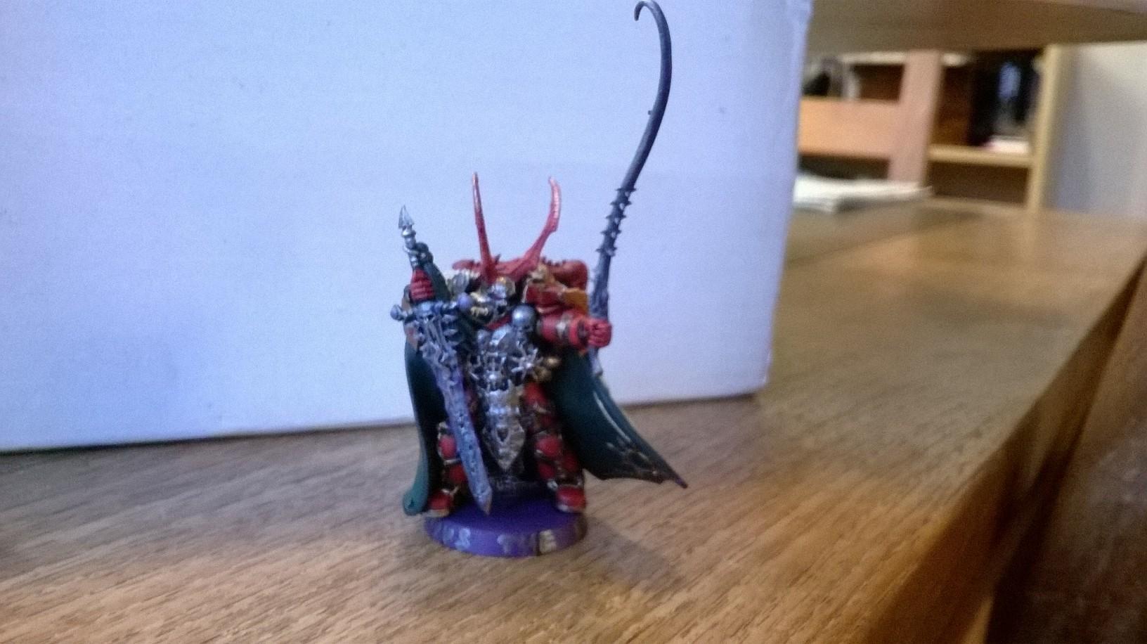 Lucius the Eternal. His armour is vaguely Khorne in colour so I made his weapons have a gluey purple tint for Slaanesh