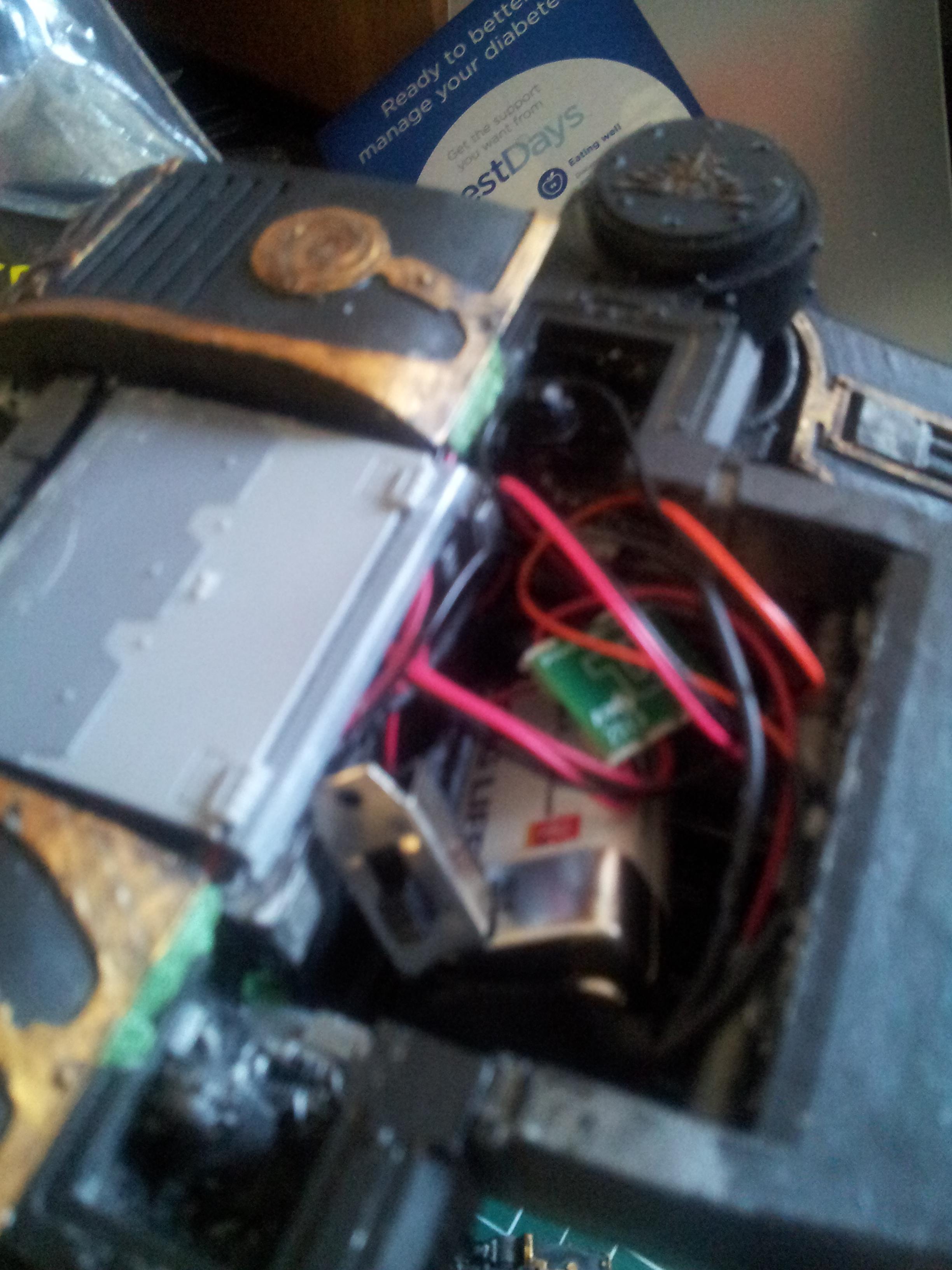 current wiring mess: the grey plate covers the future battery  area