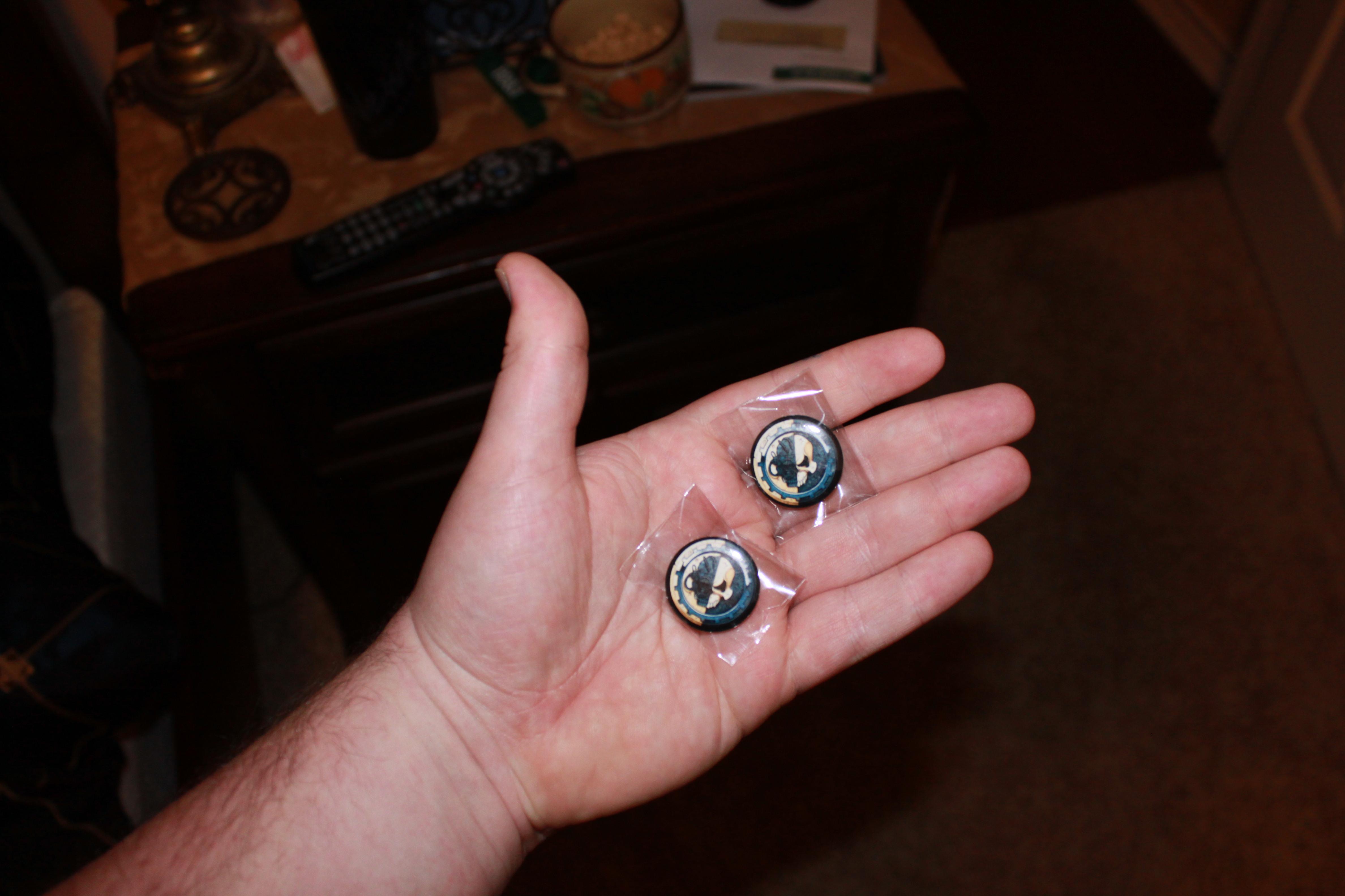 also came some cool buttons...Which I will of course wear to school and work...duh