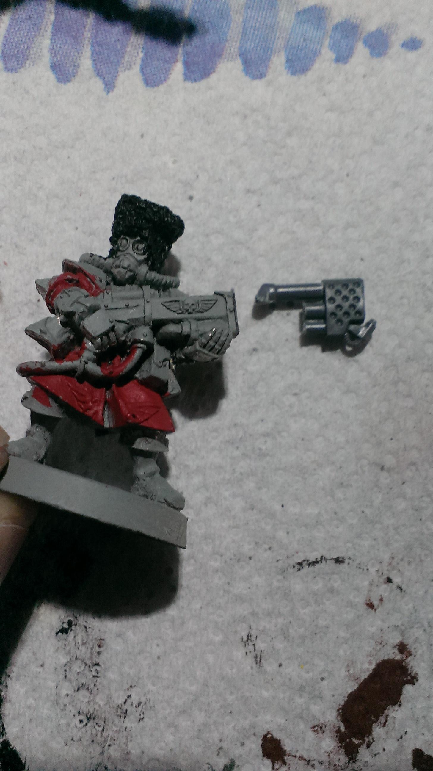 Cut away the flamer tip from the model. Take the heavy flamer from the Cadian Command box and cut as shown