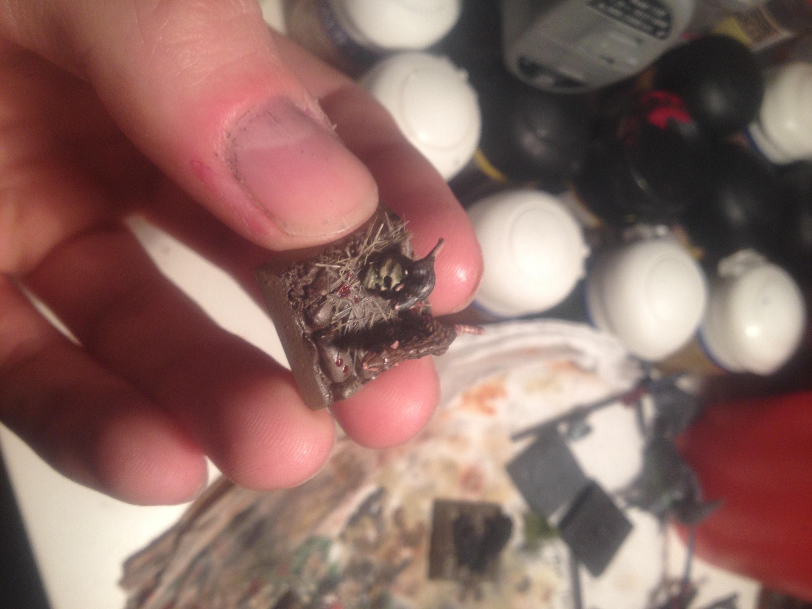 One tiny rat on a skull inside a next. I painted the skull more greenish and rotting rather than bleached and clean. There you can see my best attempt thus far of the "straw" bedding. 