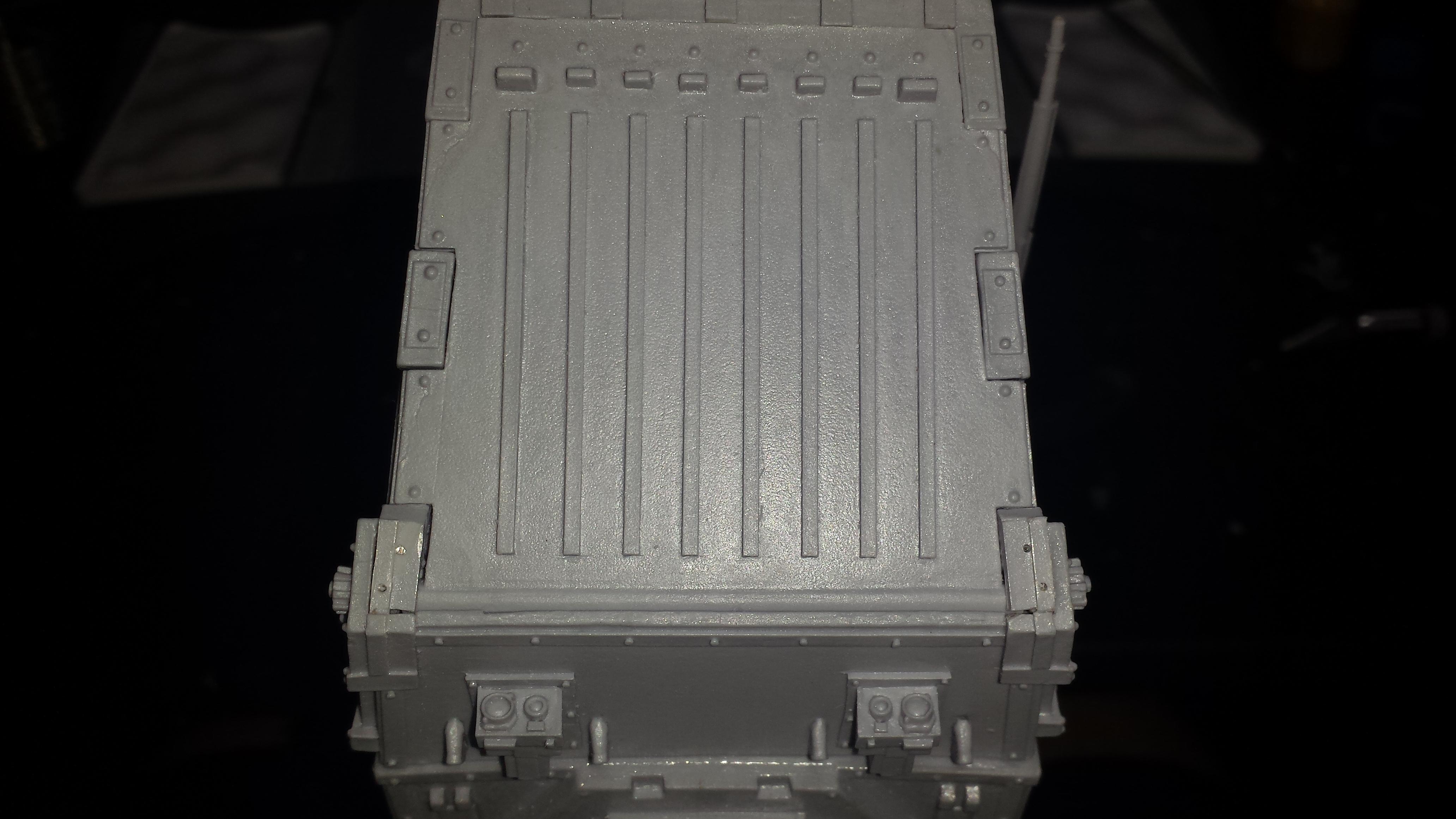 The main door is mounted in place with 2 small plastic bits. I decided it''s better to pin them and fix the holes with greenstuff later