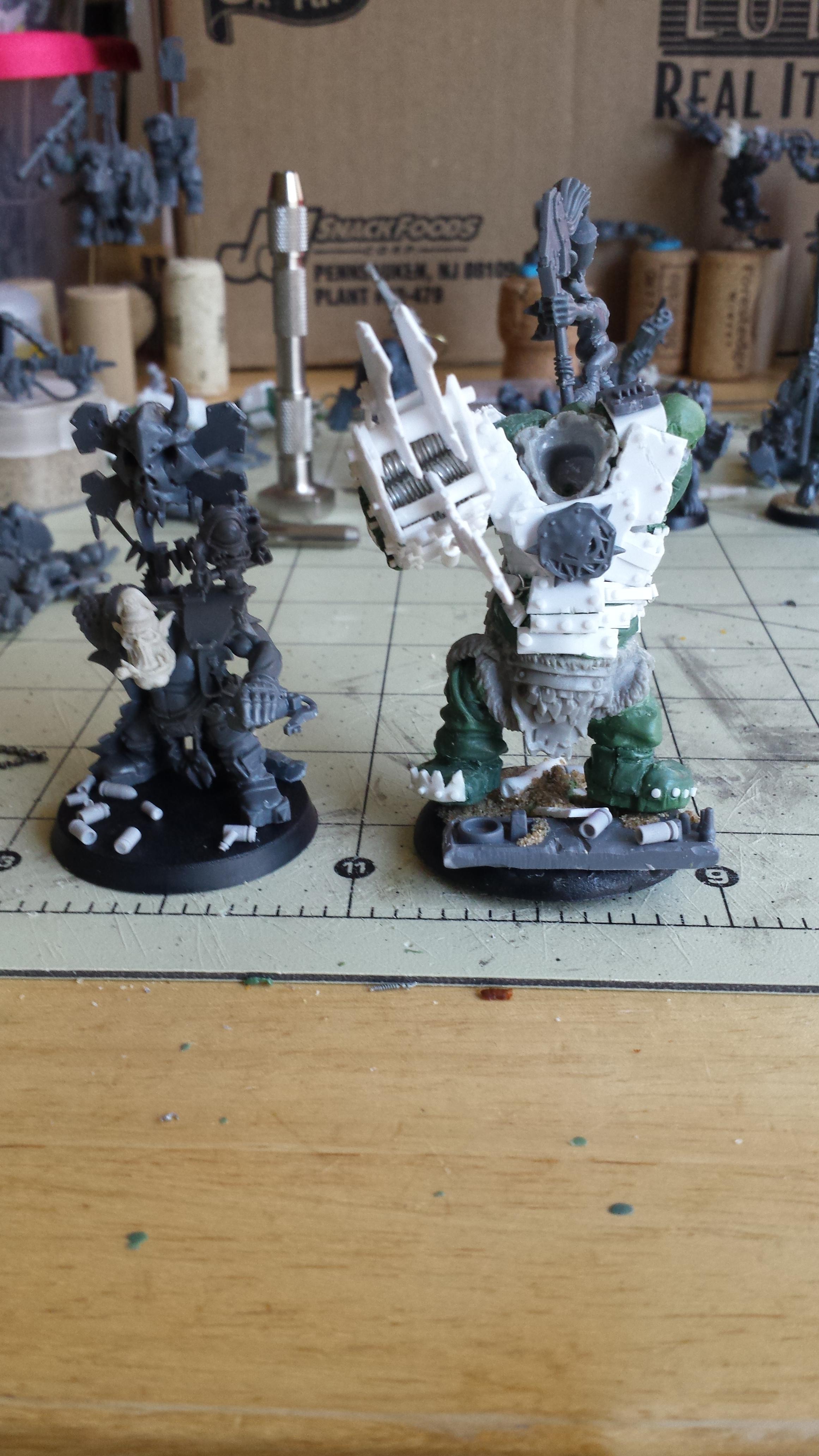 My Evil Sunz War Boss next to a new Flash Gitz. To show size