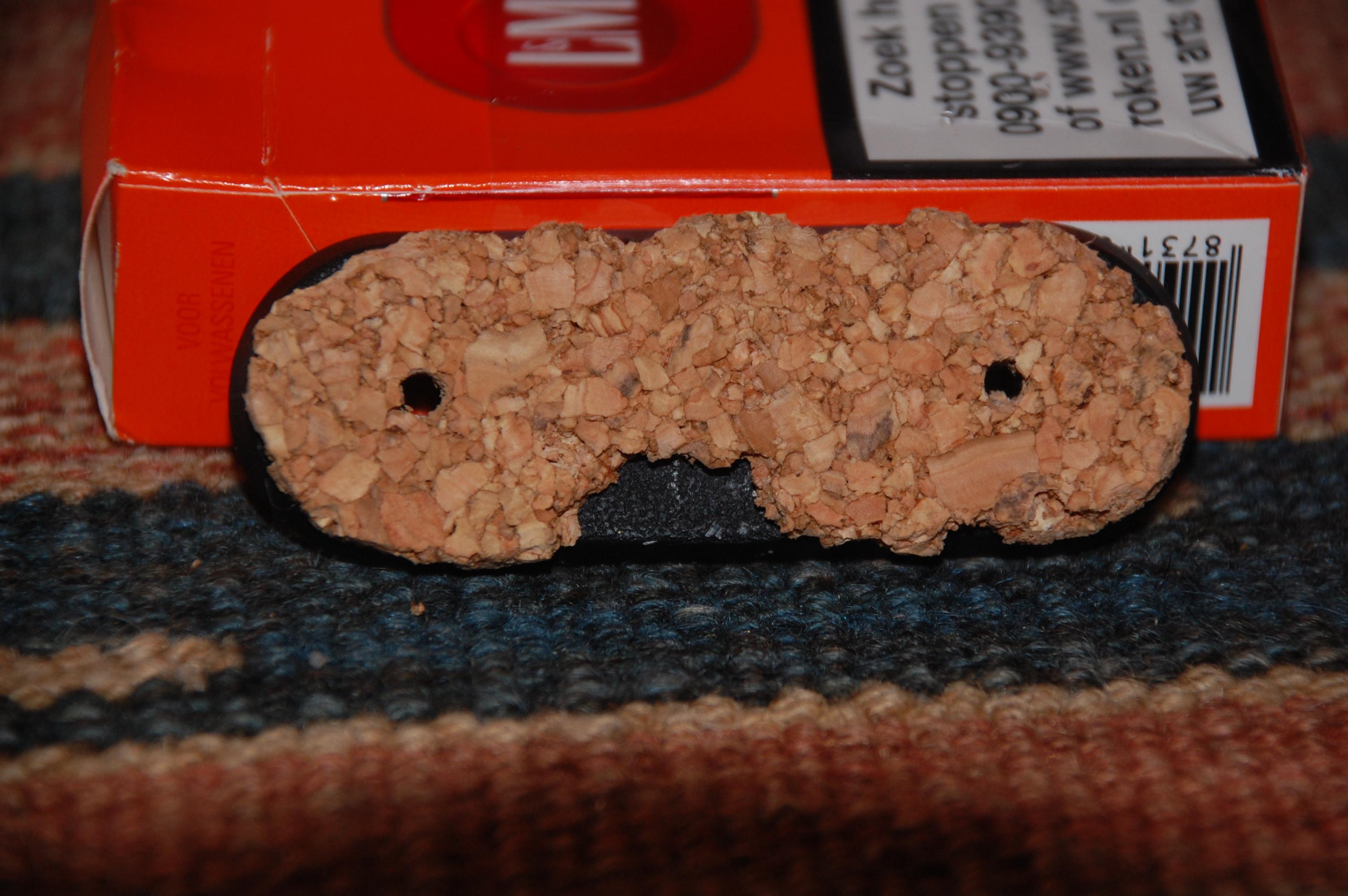 Cork added to the base and damaged to create room to put small details in place