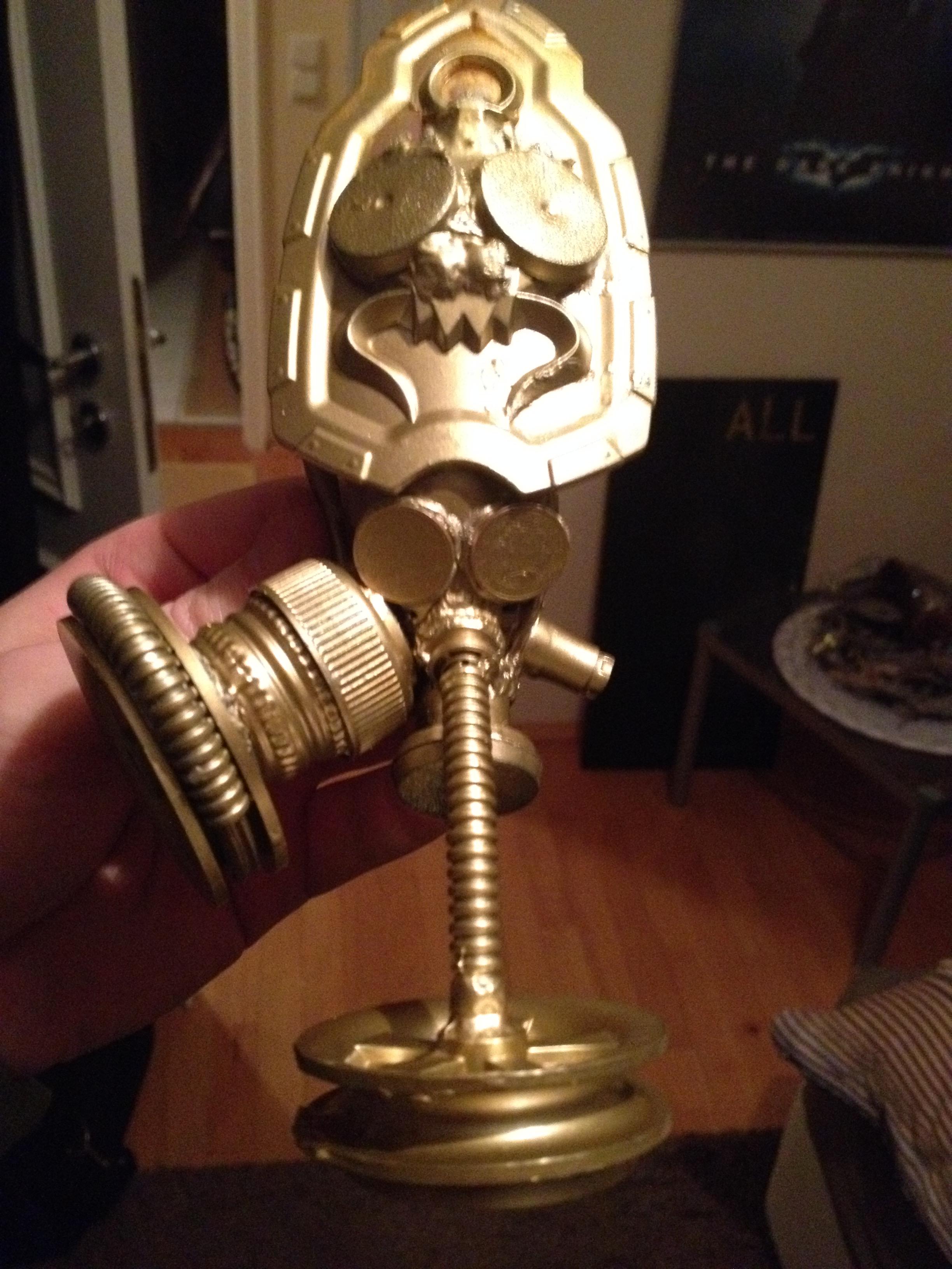 I expanded the head to give it the look of the hat of a priest / cardinal. 