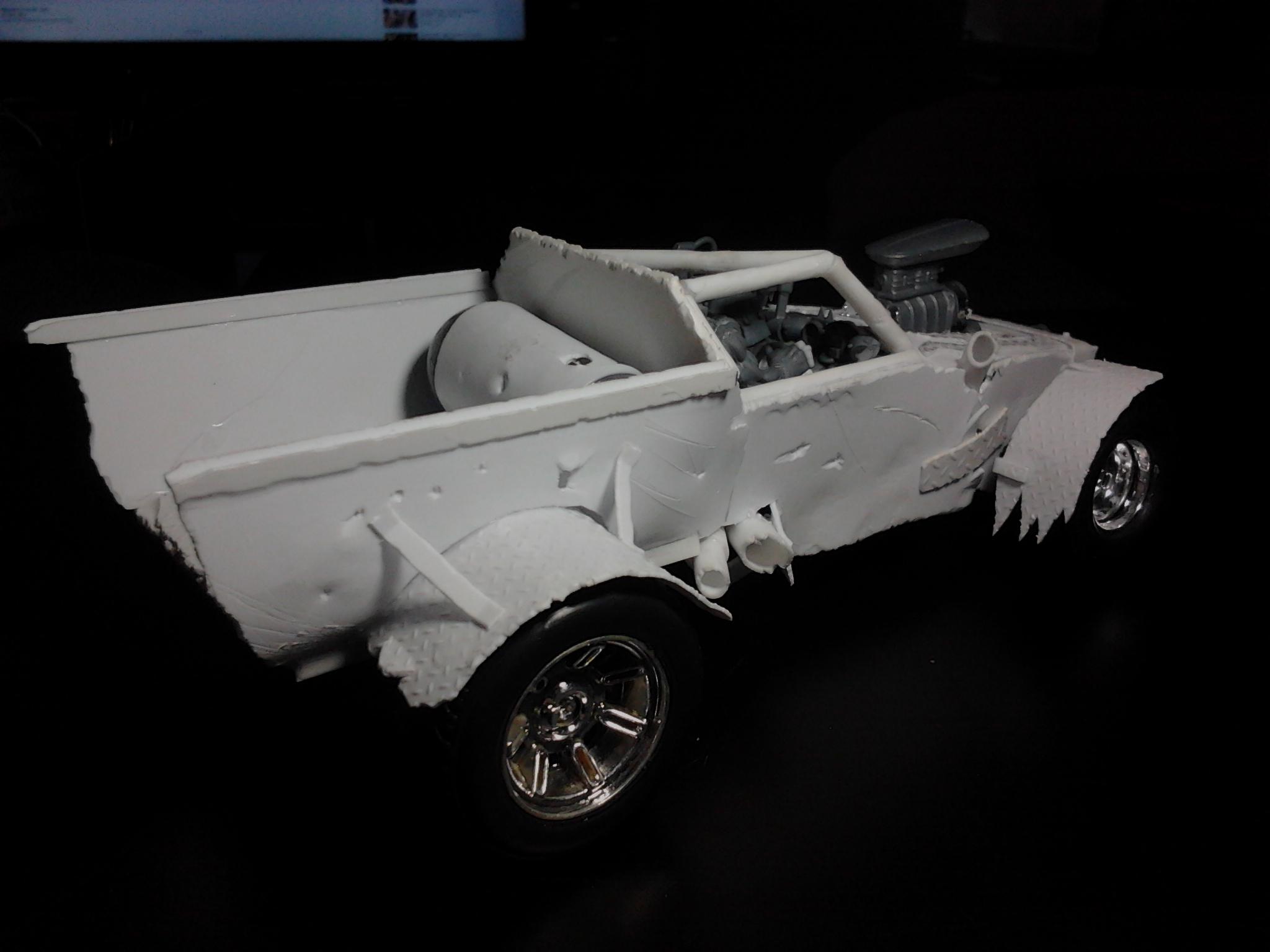 You can see the fuel tank being test fitted here. No interior work done on the tray, yet :)