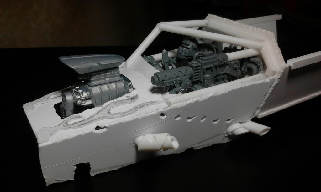 The base panel for the left side with some exhaust pipes showing. not alot of shaping yet