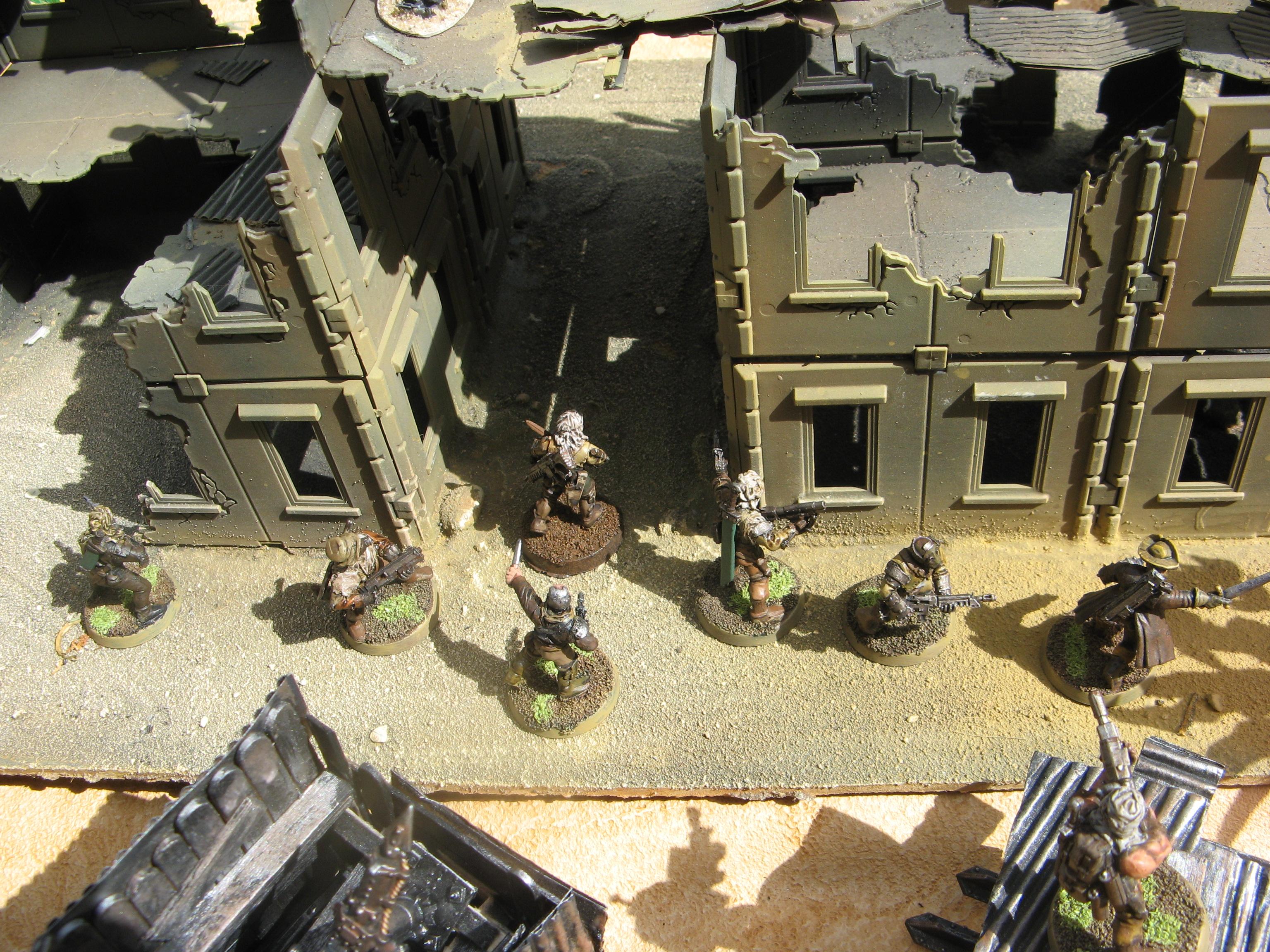 Fanning out into the compound the weapons are locked and loaded. 