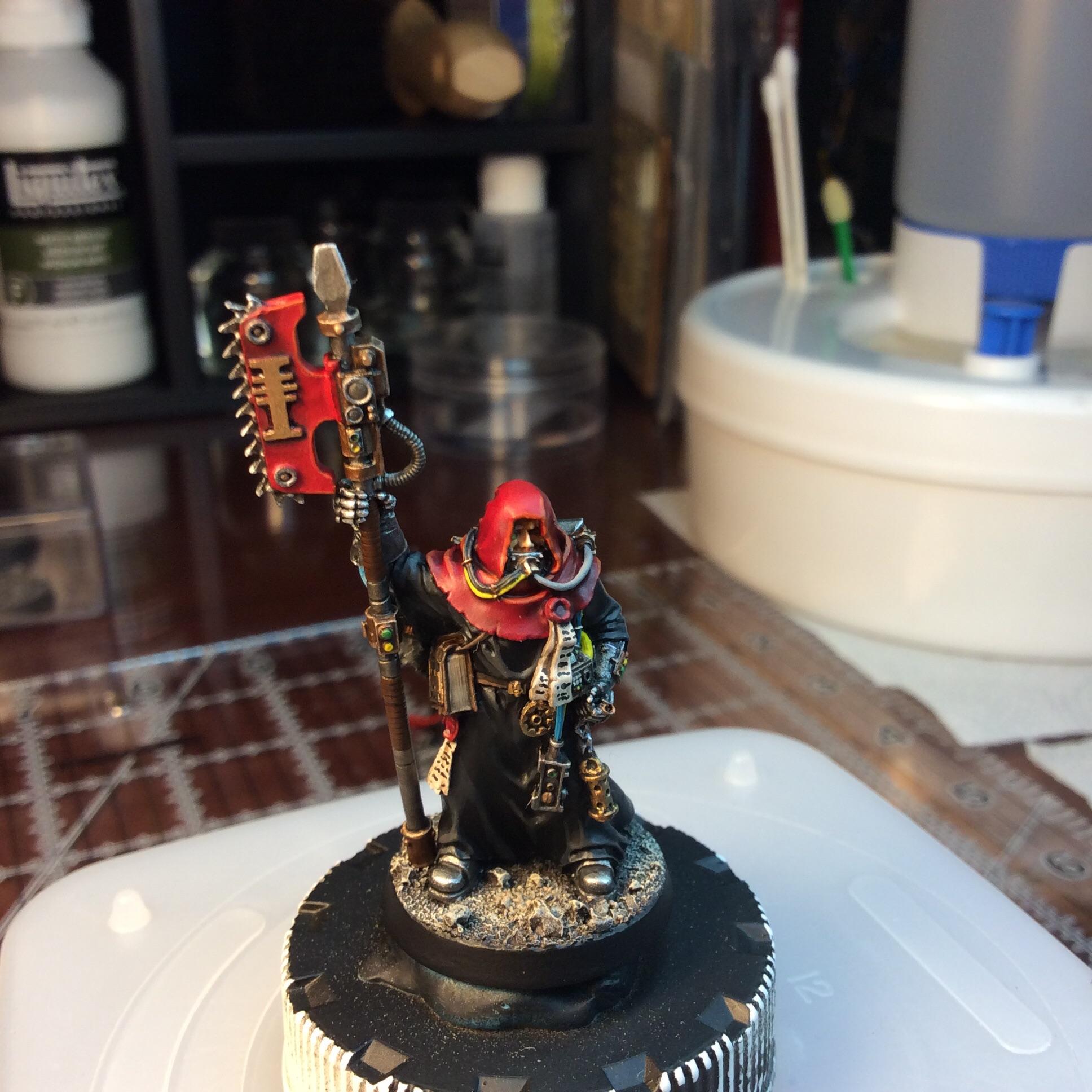 Inquisitorial Priest with Eviscerator. Converted from a FW Titan Tech Priest. 