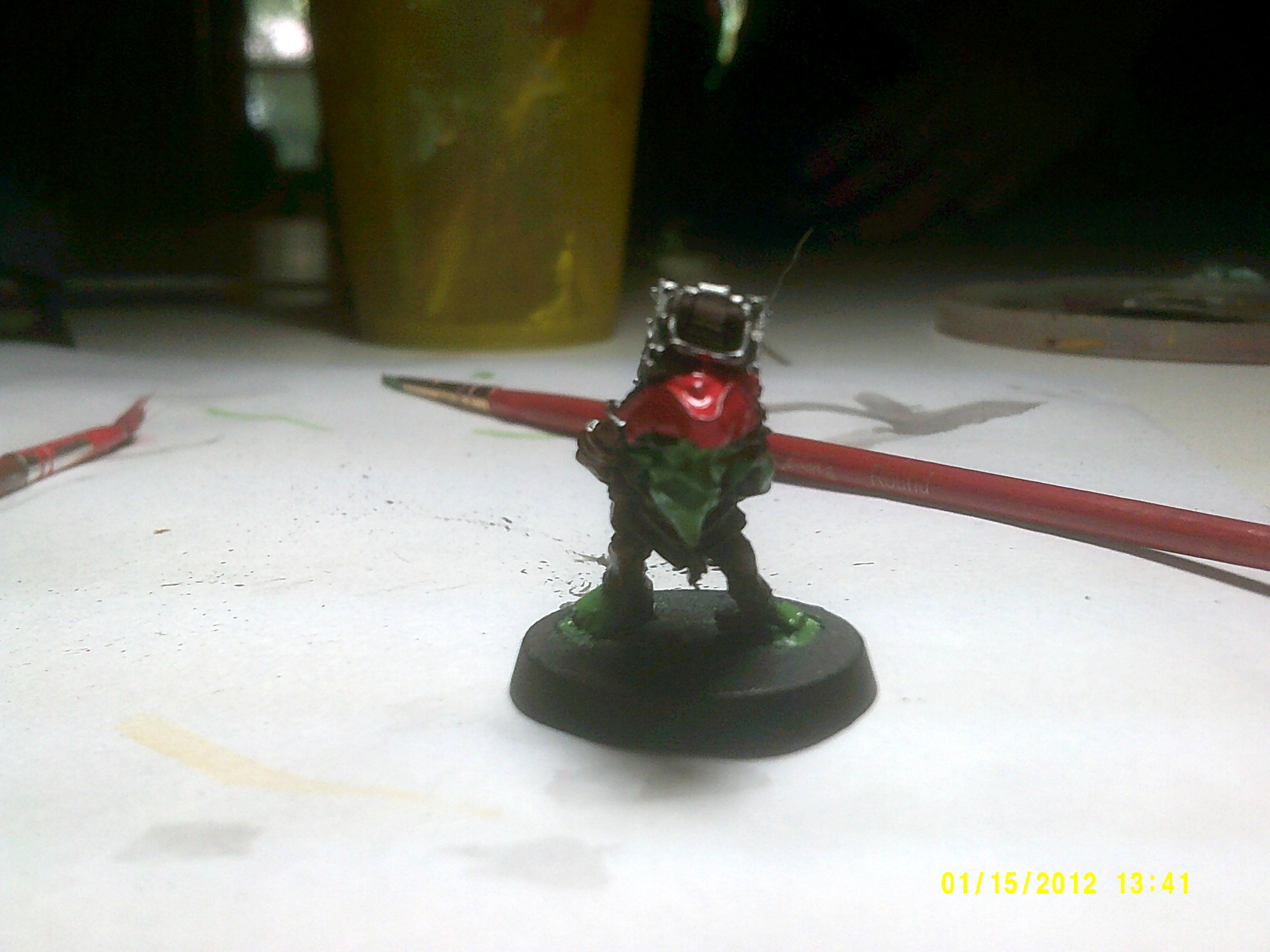 Ammo runt with red on his hat and skin painted green