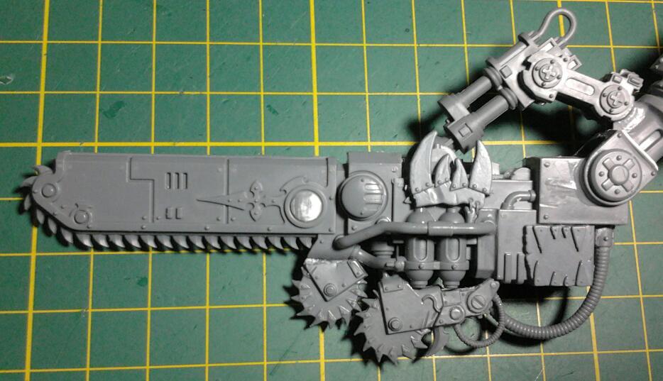 Extra blades and glyphs to make it more Orky